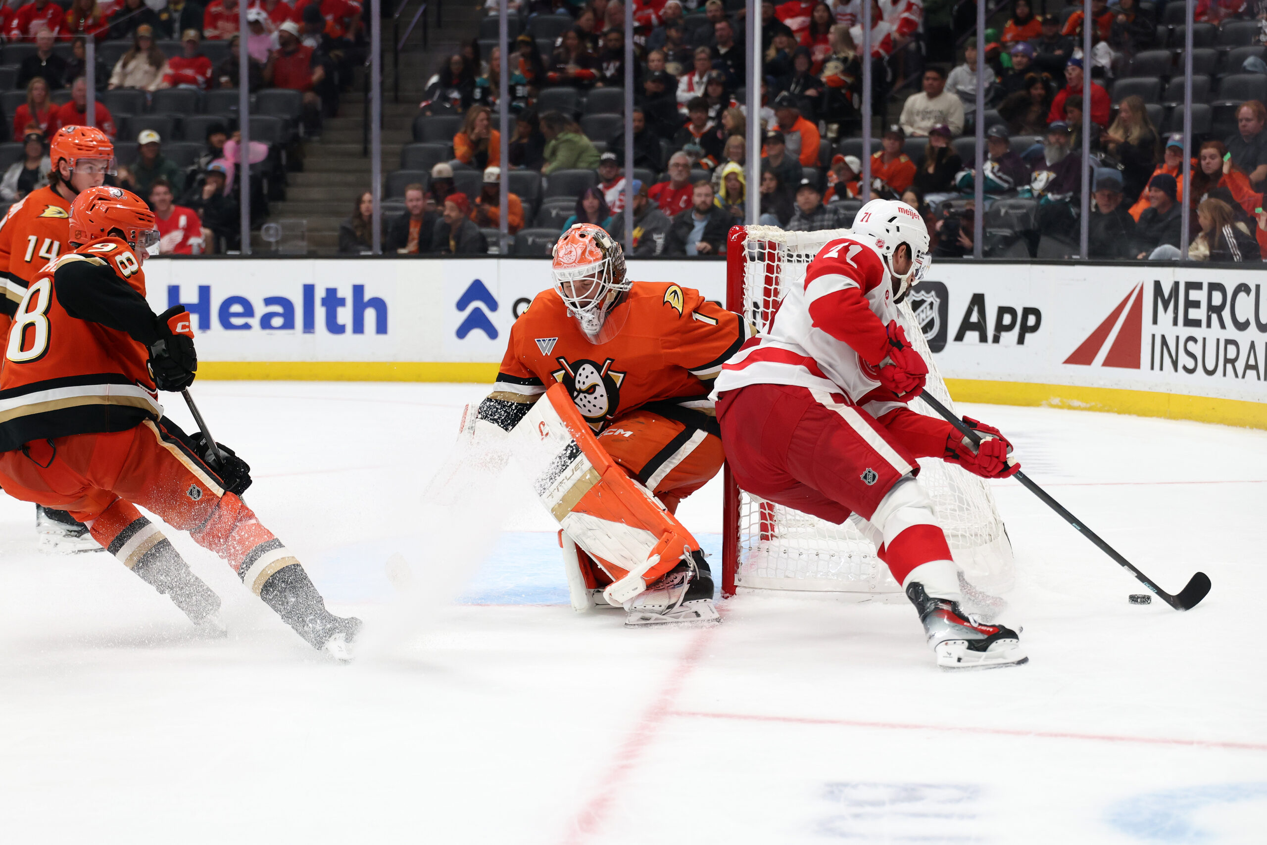 Oct 31, 2025; Anaheim, California, USA; Detroit Red Wings center Dylan Larkin (71) controls the puck against Anaheim Ducks goaltender Lukas Dostal (1) during the third period at Honda Center. Mandatory Credit: Kiyoshi Mio-Imagn Images