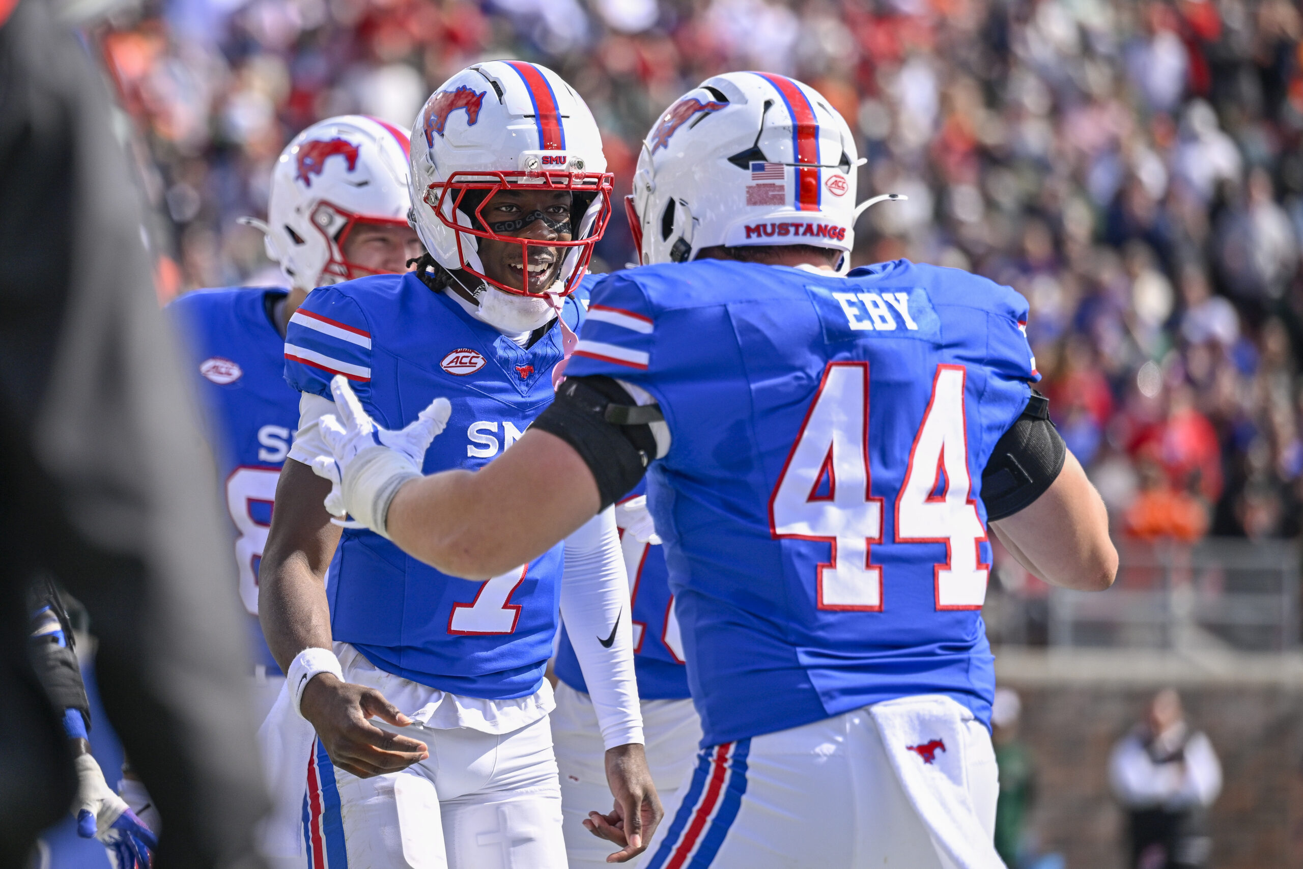 Nov 1, 2025; Dallas, Texas, USA; SMU Mustangs quarterback Kevin Jennings (7) and tight end Stone Eby (44) celebrates after Jennings scores a touchdown against the Miami Hurricanes during the second half at Gerald J. Ford Stadium. Mandatory Credit: Jerome Miron-Imagn Images