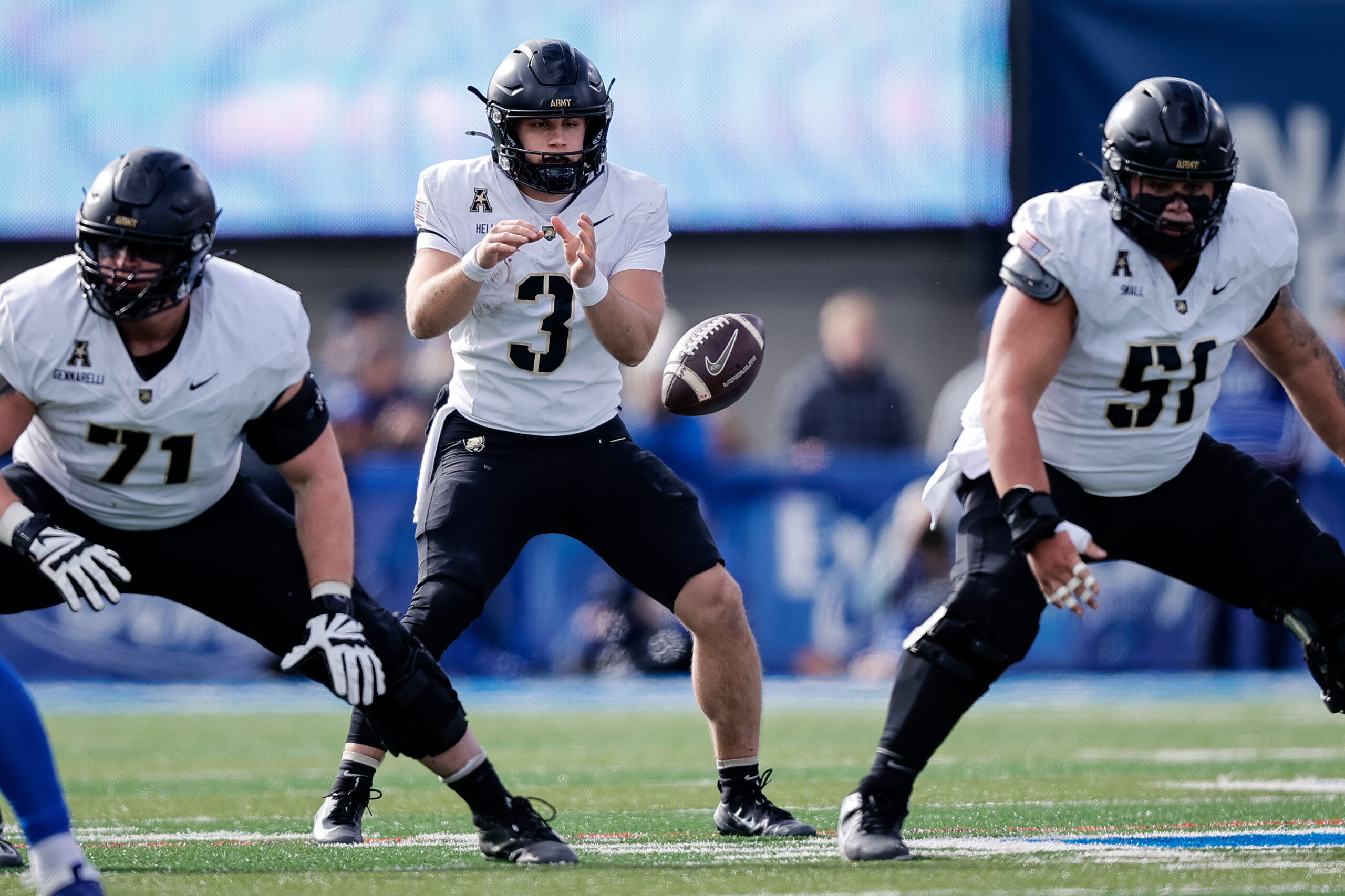 Nov 1, 2025; Colorado Springs, Colorado, USA; Army West Point Black Knights quarterback Cale Hellums (3) takes a snap from offensive lineman Brady Small (51) in the second quarter against the Air Force Falcons at Falcon Stadium. Mandatory Credit: Isaiah J. Downing-Imagn Images