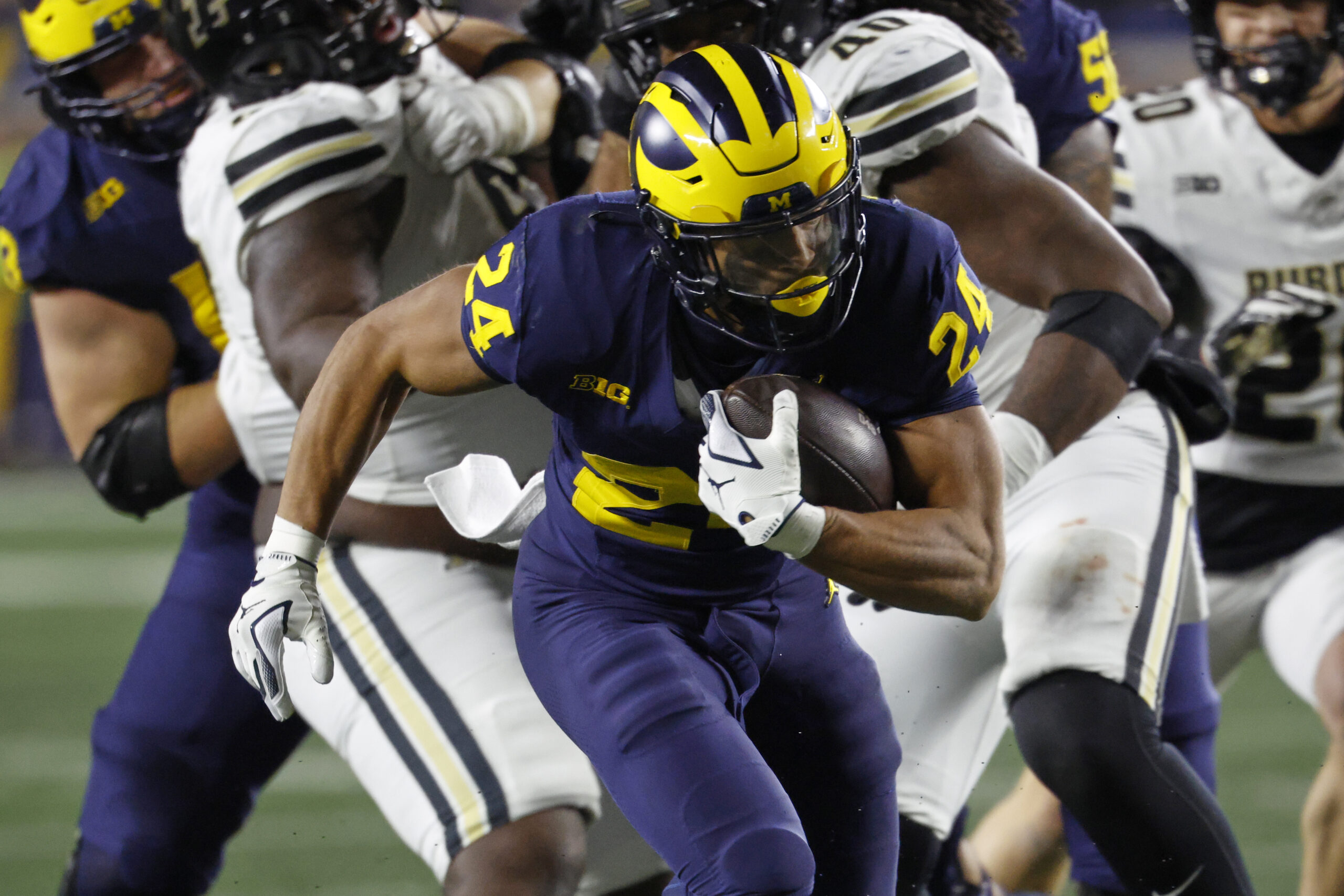 Nov 1, 2025; Ann Arbor, Michigan, USA; Michigan Wolverines running back Bryson Kuzdzal (24) rushes in the second half against the Purdue Boilermakers at Michigan Stadium. Mandatory Credit: Rick Osentoski-Imagn Images