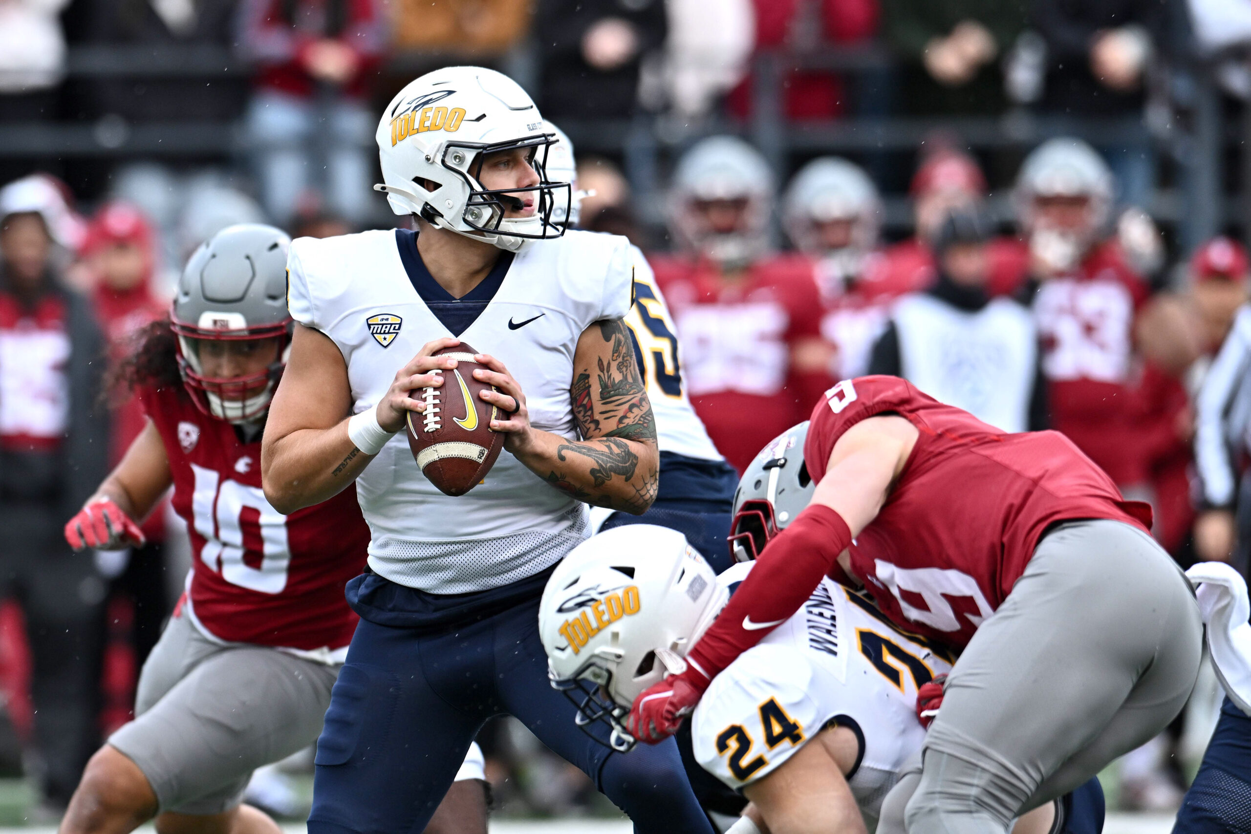 Oct 25, 2025; Pullman, Washington, USA; Toledo Rockets quarterback Tucker Gleason (4) throws a pass against the Washington State Cougars in the first half at Gesa Field at Martin Stadium. Mandatory Credit: James Snook-Imagn Images