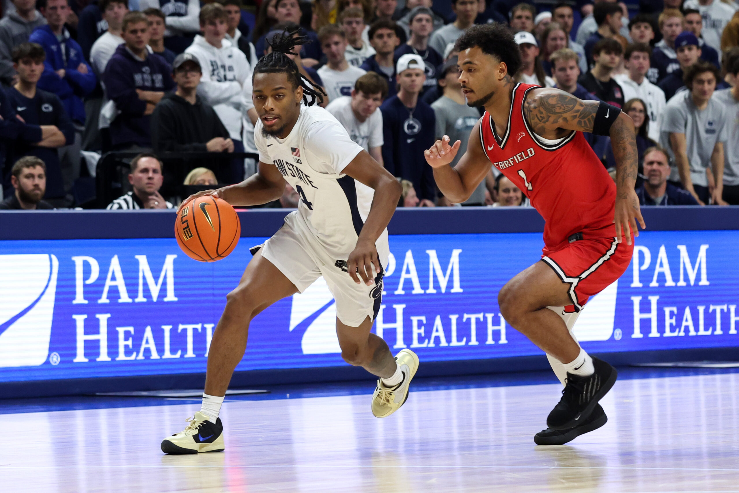 Nov 3, 2025; University Park, Pennsylvania, USA; Penn State Nittany Lions guard Kayden Mingo (4) dribbles during the first half against the Fairfield Stags at Bryce Jordan Center. Mandatory Credit: Matthew O'Haren-Imagn Images
