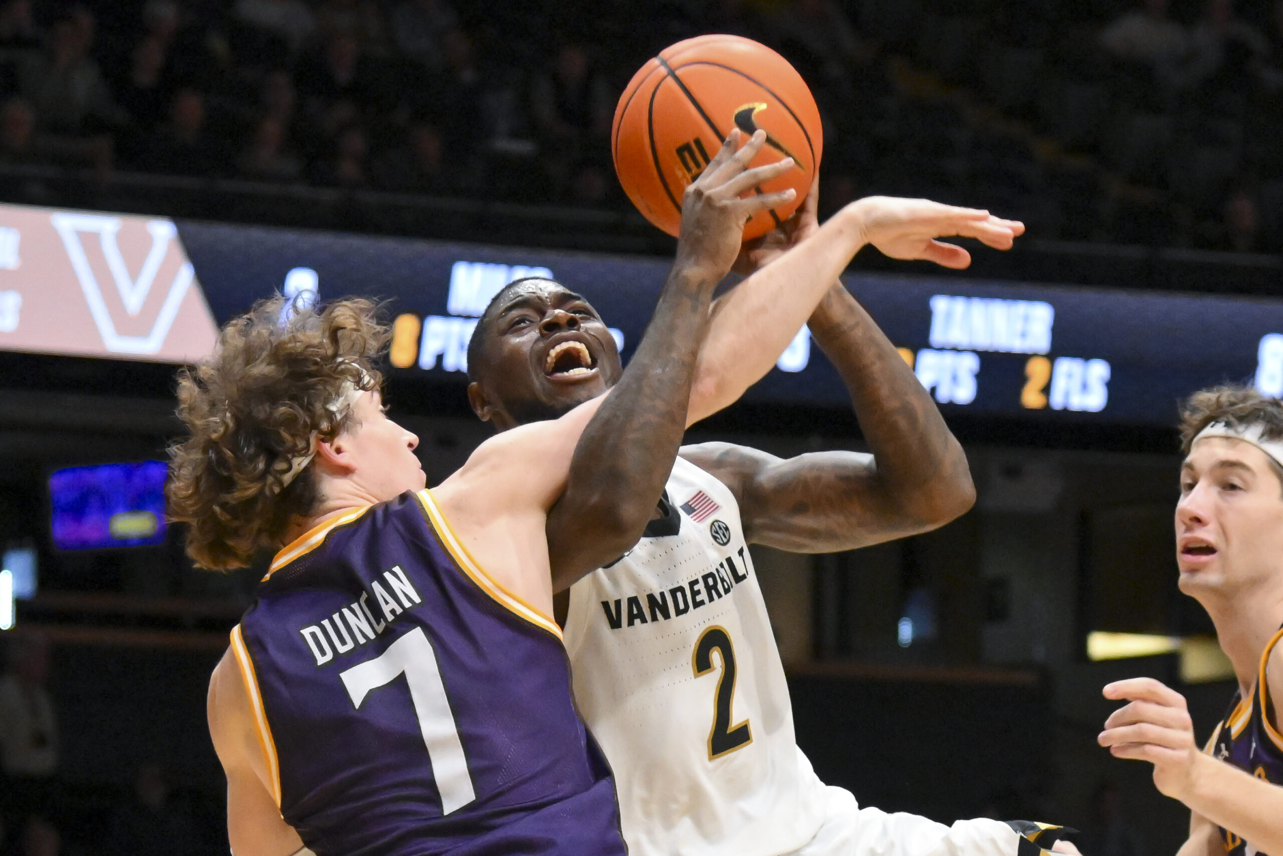 Nov 3, 2025; Nashville, Tennessee, USA;  Lipscomb Bisons guard Ethan Duncan (7) fouls Vanderbilt Commodores guard Duke Miles (2) during the second half at Memorial Gymnasium. Mandatory Credit: Steve Roberts-Imagn Images
