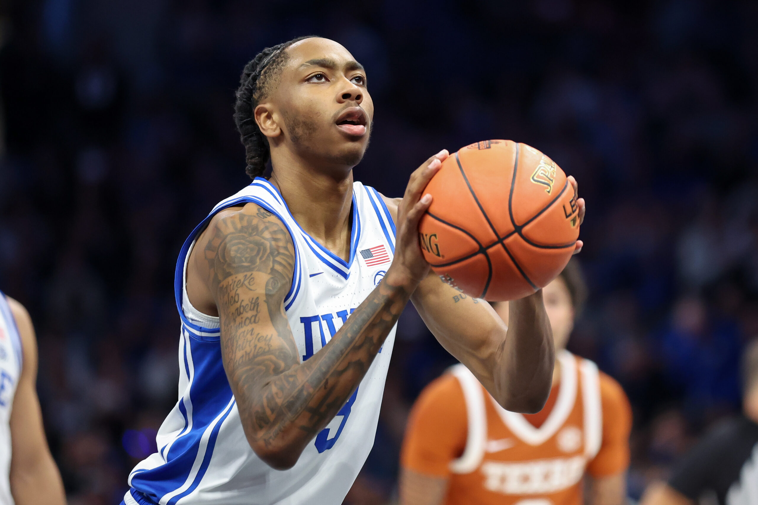 Nov 4, 2025; Charlotte, North Carolina, USA; Duke Blue Devils guard Isaiah Evans (3) shoots a free throw against the Texas Longhorns during the first half of the Dick Vitale’s Invitational game at Spectrum Center. Mandatory Credit: Cory Knowlton-Imagn Images