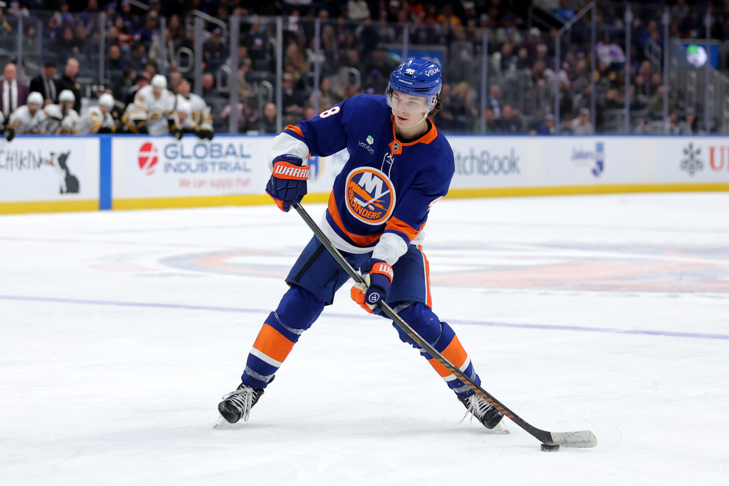 Nov 4, 2025; Elmont, New York, USA; New York Islanders defenseman Matthew Schaefer (48) skates with the puck against the Boston Bruins during the second period at UBS Arena. Mandatory Credit: Brad Penner-Imagn Images