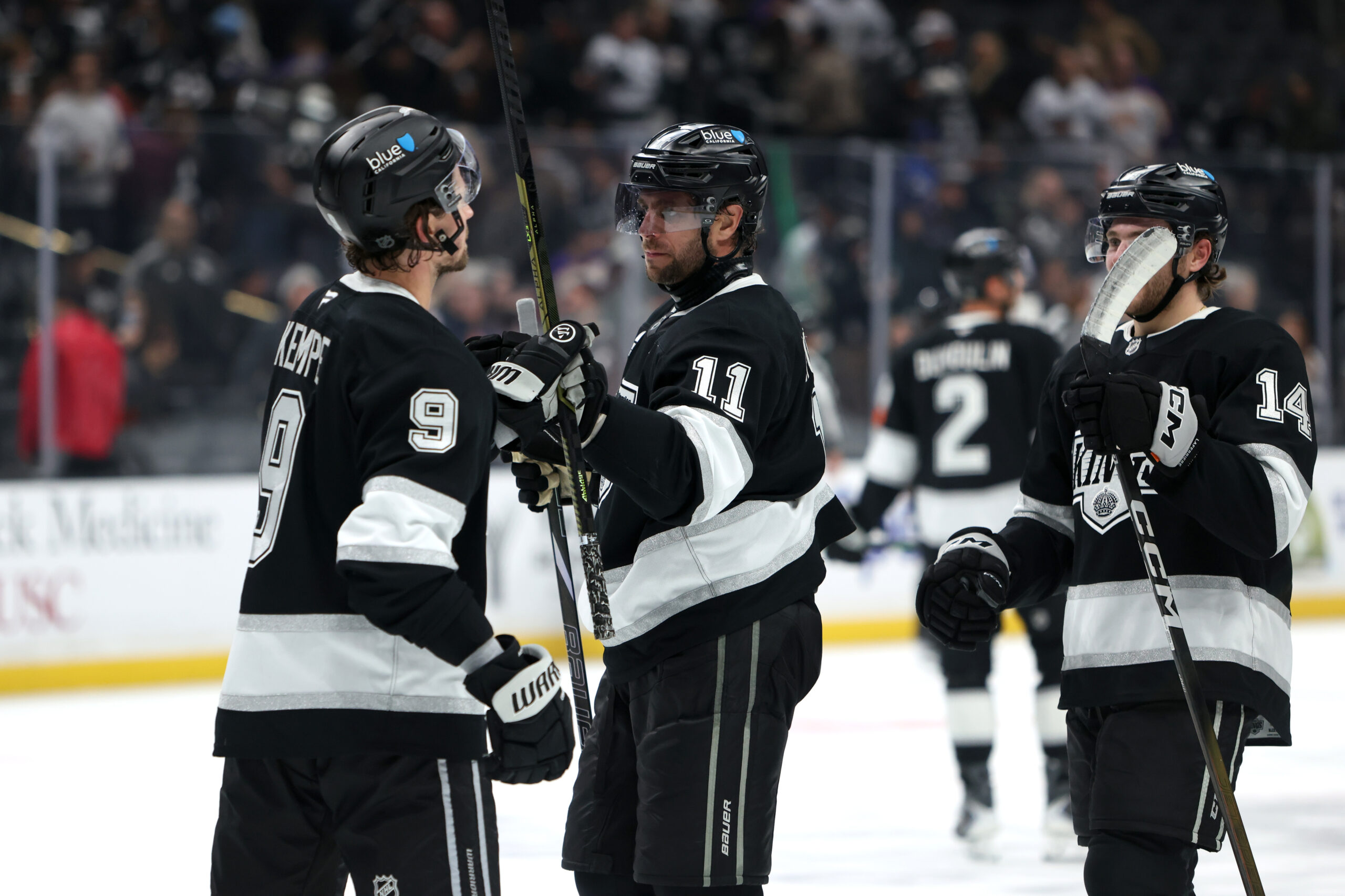 Nov 4, 2025; Los Angeles, California, USA; Los Angeles Kings center Anze Kopitar (11) celebrates a win with right wing Adrian Kempe (9) after defeating the Winnipeg Jets 3-0 at Crypto.com Arena. Mandatory Credit: Kiyoshi Mio-Imagn Images