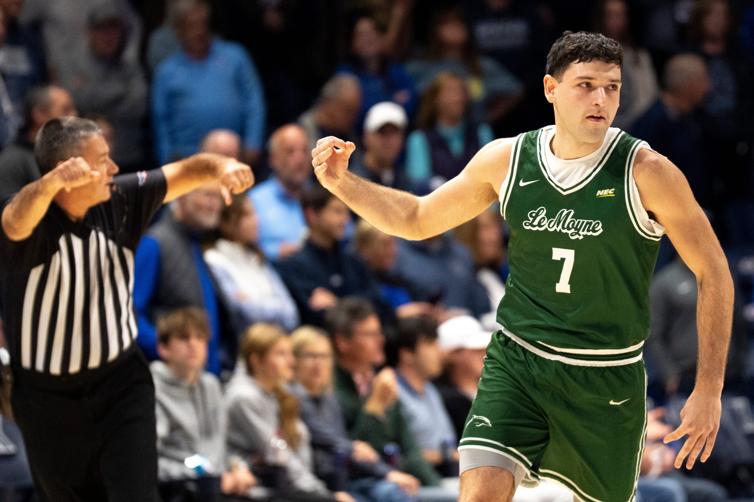 Le Moyne Dolphins guard Trent Mosquera (7) gestures after hitting a 3-point shot in the first half of the NCAA game at the Cintas Center in Cincinnati on Nov. 6, 2025.