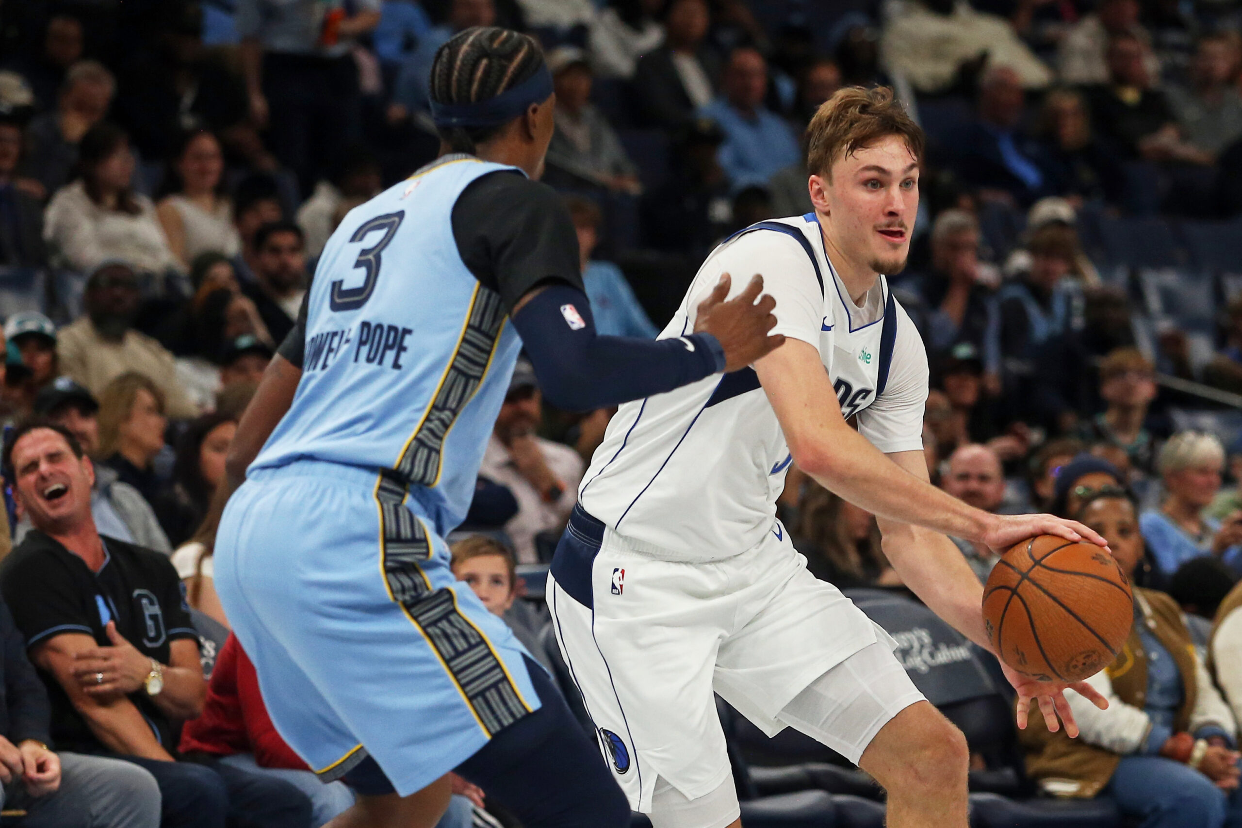 Nov 7, 2025; Memphis, Tennessee, USA; Dallas Mavericks forward Cooper Flagg (32) passes the ball against Memphis Grizzlies forward Kentavious Caldwell-Pope (3) during the third quarter at FedExForum. Mandatory Credit: Petre Thomas-Imagn Images