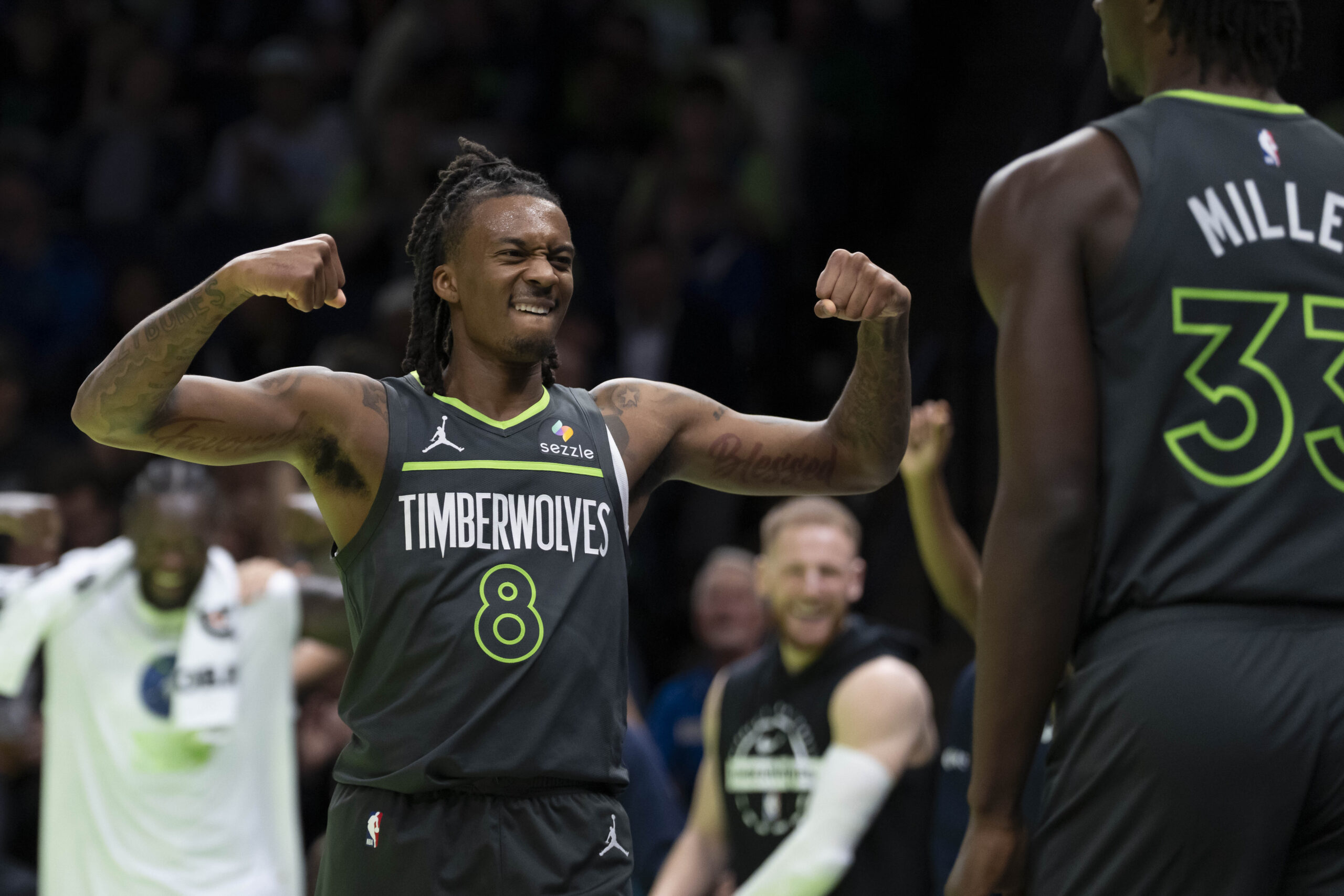 Nov 7, 2025; Minneapolis, Minnesota, USA; Minnesota Timberwolves guard Bones Hyland (8) reacts after forward Leonard Miller (33) makes a shot and gets fouled against the Utah Jazz in the second half at Target Center. Mandatory Credit: Jesse Johnson-Imagn Images