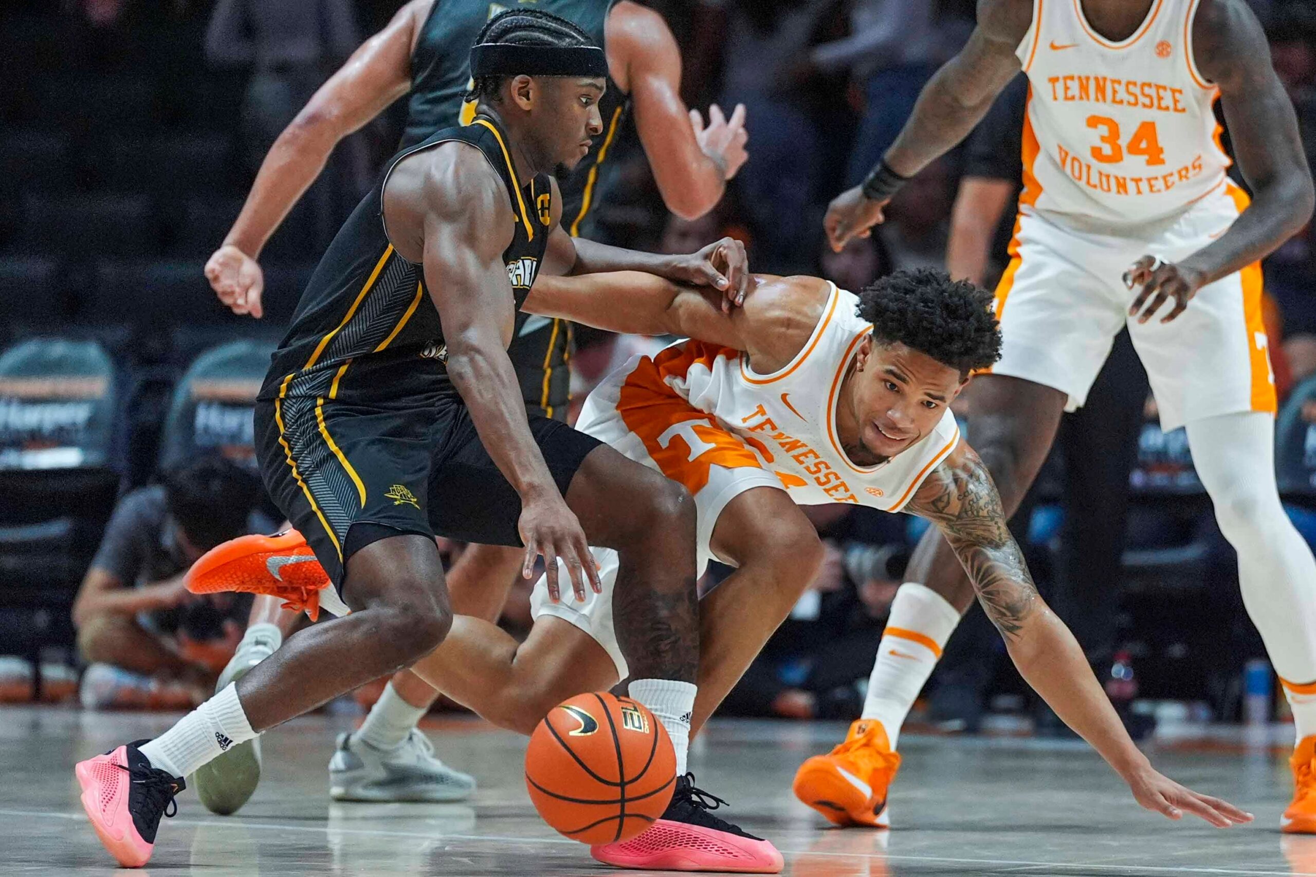Tennessee guard Troy Henderson (24) trips over Northern Kentucky guard Donovan Oday (8) during a NCAA basketball game between the Tennessee Volunteers and Northern Kentucky Norse at Thompson-Boling Arena at Food City Center on Nov. 8, 2025.