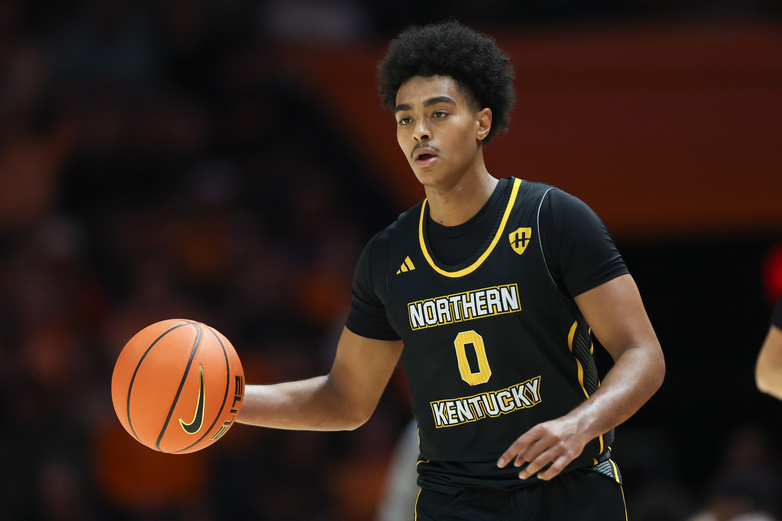 Nov 8, 2025; Knoxville, Tennessee, USA;  Northern Kentucky Norse guard Dan Gherezgher (0) brings the ball upcourt against the Tennessee Volunteers at Thompson-Boling Arena at Food City Center. Mandatory Credit: Randy Sartin-Imagn Images