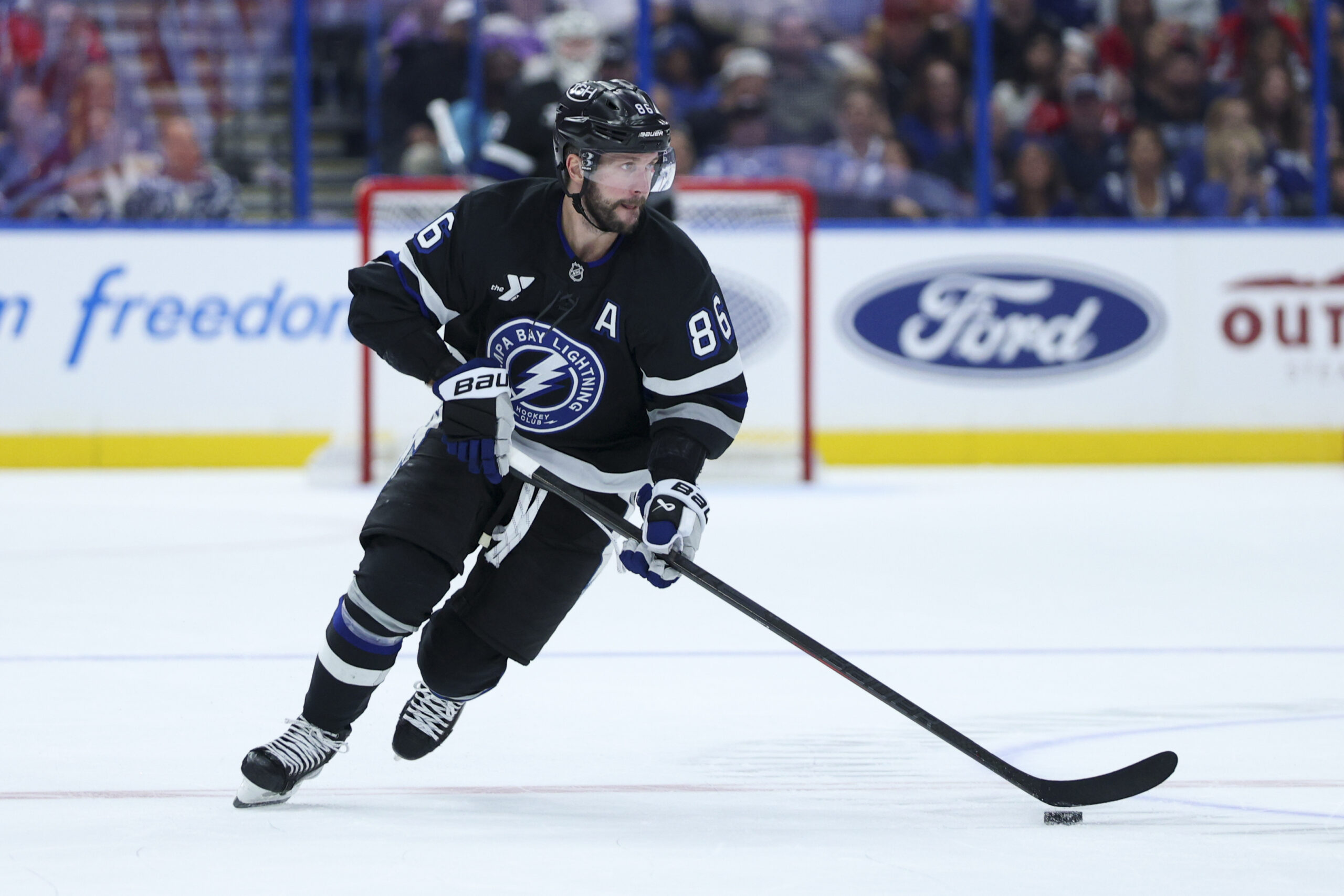 Nov 8, 2025; Tampa, Florida, USA; Tampa Bay Lightning right wing Nikita Kucherov (86) controls the puck against the Washington Capitals in the third period at Benchmark International Arena. Mandatory Credit: Nathan Ray Seebeck-Imagn Images