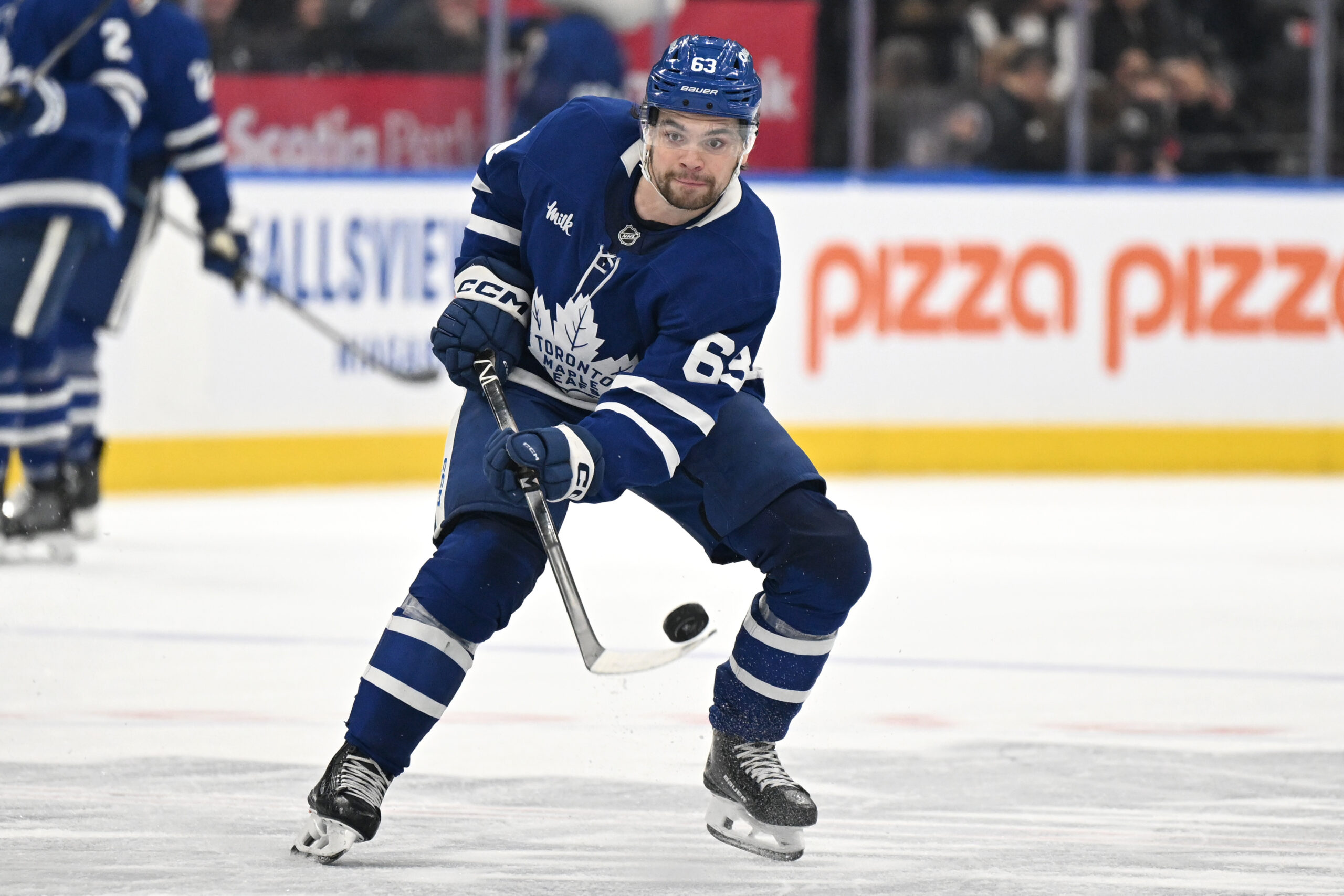 Nov 8, 2025; Toronto, Ontario, CAN; Toronto Maple Leafs forward Matias Maccelli (63) shoots the puck against the Boston Bruins in the third period at Scotiabank Arena. Mandatory Credit: Dan Hamilton-Imagn Images
