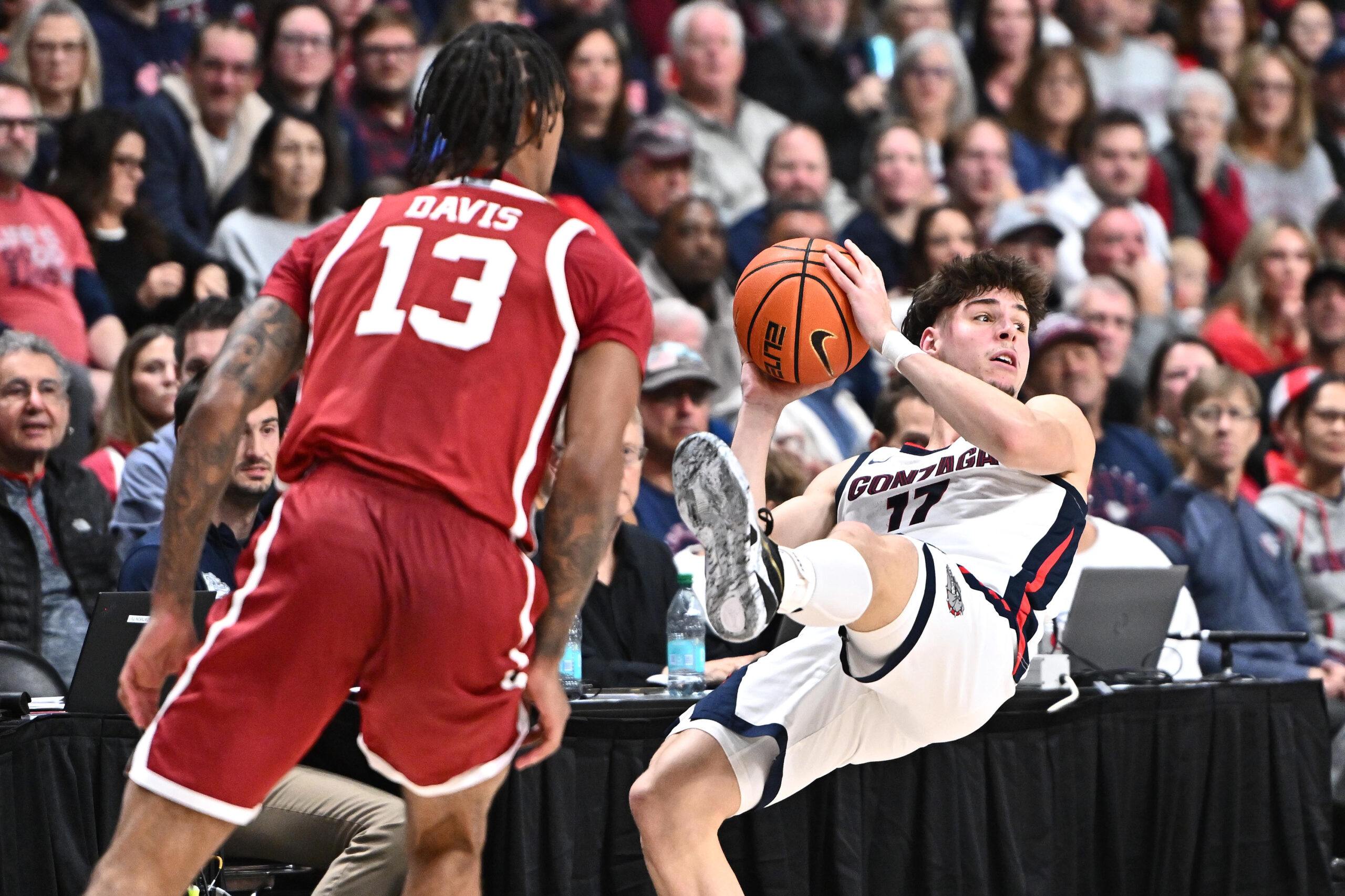 Nov 8, 2025; Spokane, Washington, USA; Gonzaga Bulldogs guard Mario Saint-Supery (17) is fouled on the drive by Oklahoma Sooners forward Tae Davis (13) in the second half at Numerica Veterans Arena. Gonzaga Bulldogs won 83-68. Mandatory Credit: James Snook-Imagn Images
