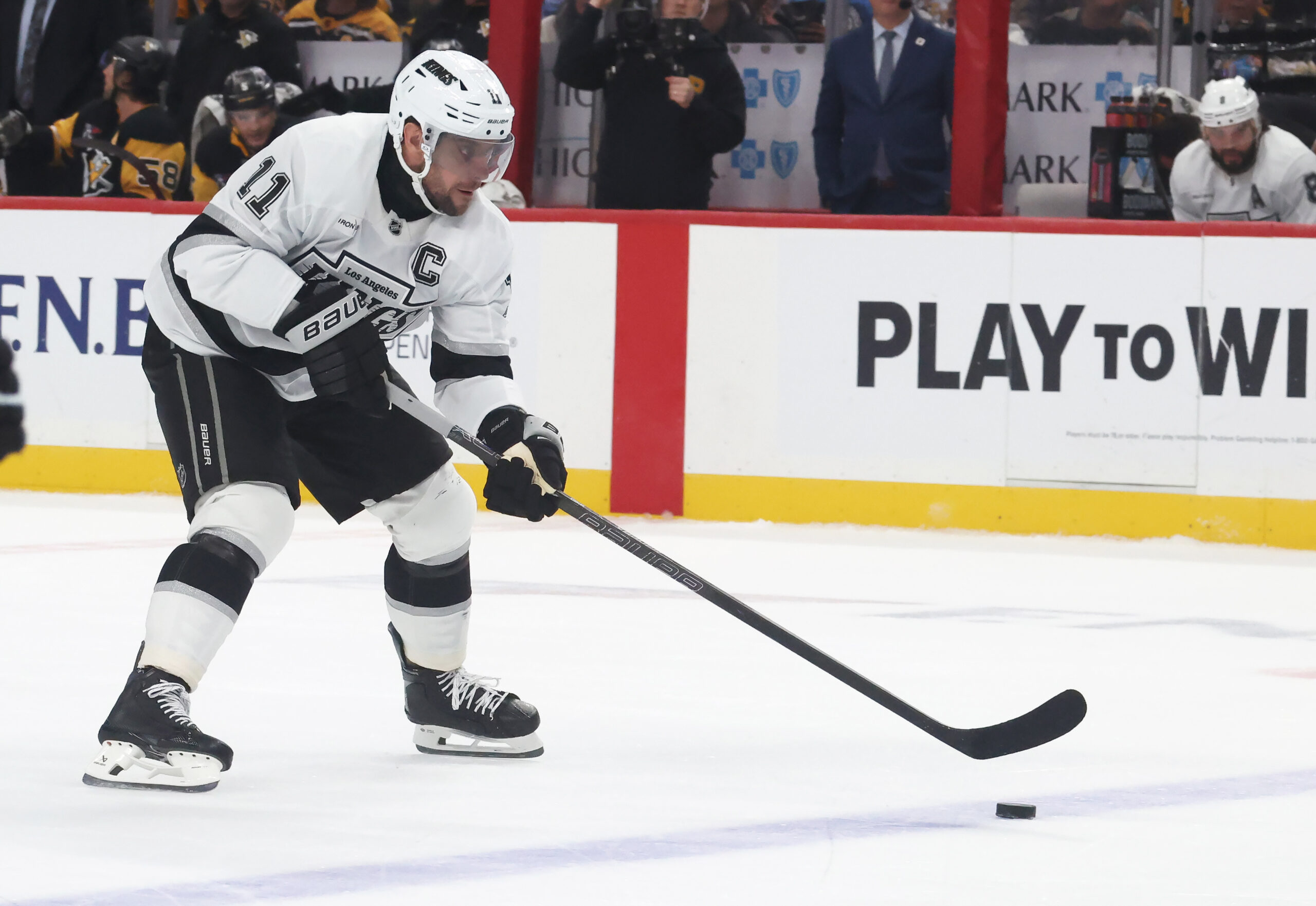 Nov 9, 2025; Pittsburgh, Pennsylvania, USA;  Los Angeles Kings center Anze Kopitar (11) skates with the puck against the Pittsburgh Penguins during the second period at PPG Paints Arena. Mandatory Credit: Charles LeClaire-Imagn Images