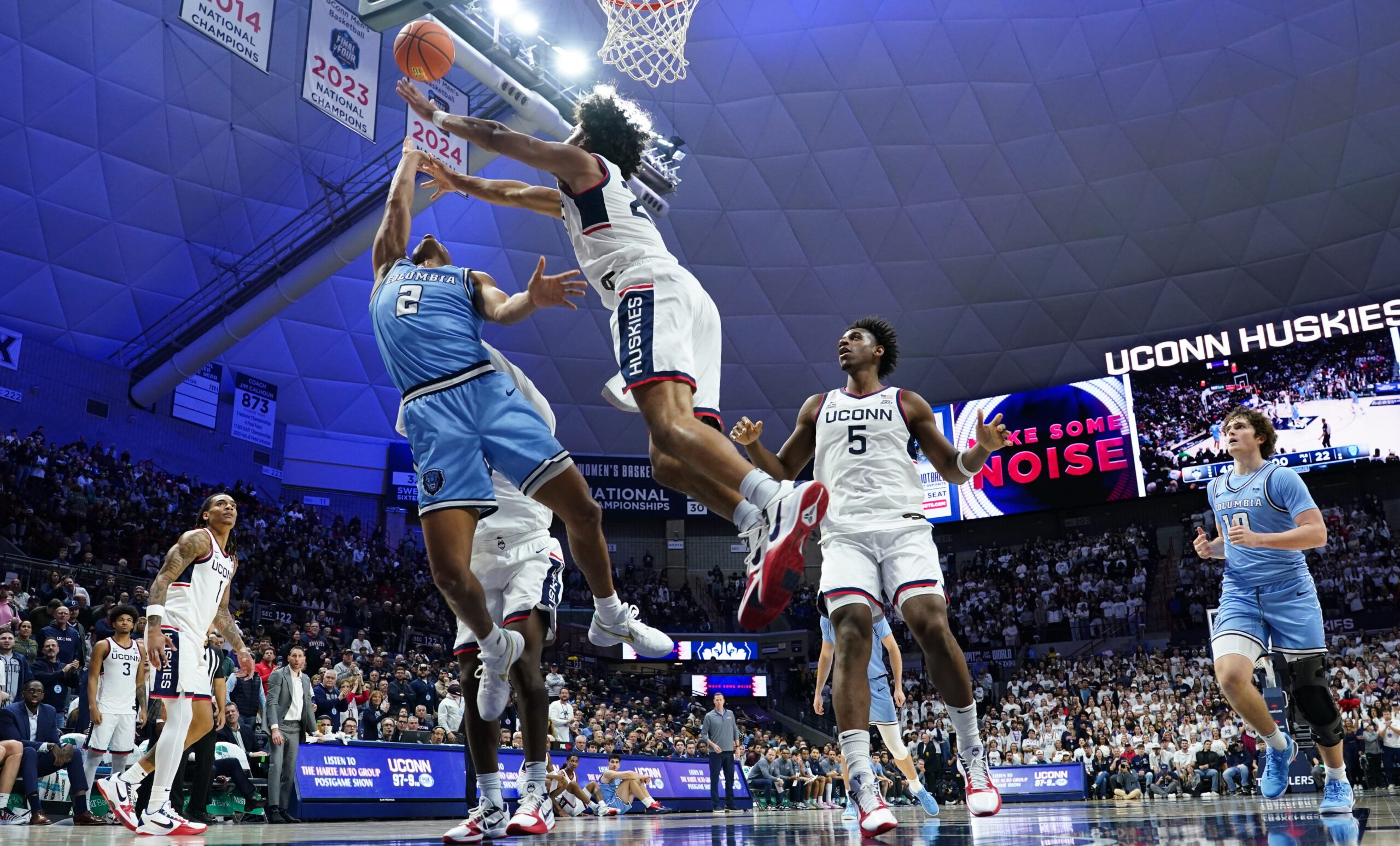 Nov 10, 2025; Storrs, Connecticut, USA; UConn Huskies forward Jayden Ross (23) defends against Columbia Lions guard Kenny Noland (2) in the first half at Harry A. Gampel Pavilion. Mandatory Credit: David Butler II-Imagn Images