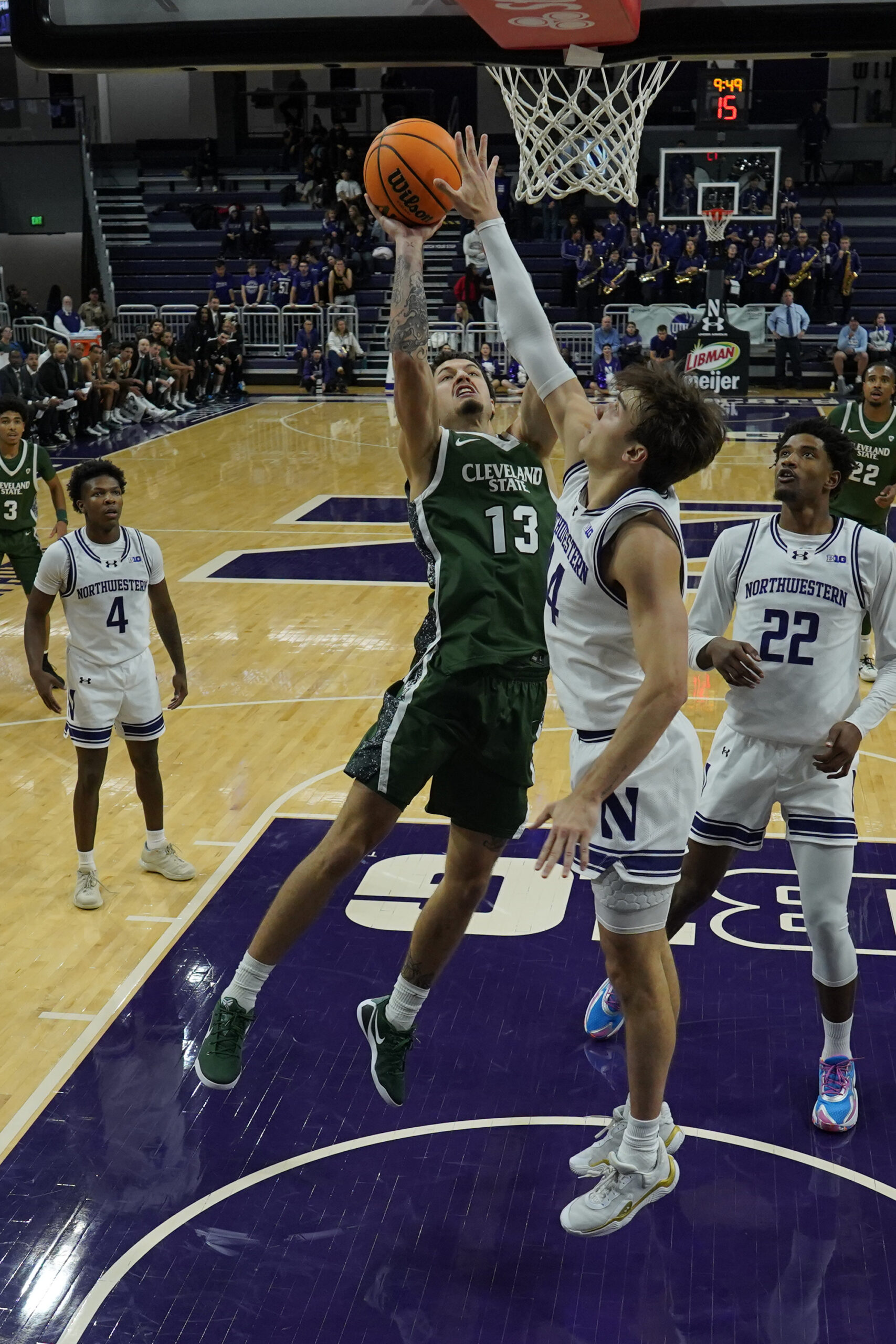 Nov 10, 2025; Evanston, Illinois, USA; Northwestern Wildcats guard Angelo Ciaravino (44) defends Cleveland State Vikings guard Lucas Burton (13) during the first half at Welsh-Ryan Arena. Mandatory Credit: David Banks-Imagn Images