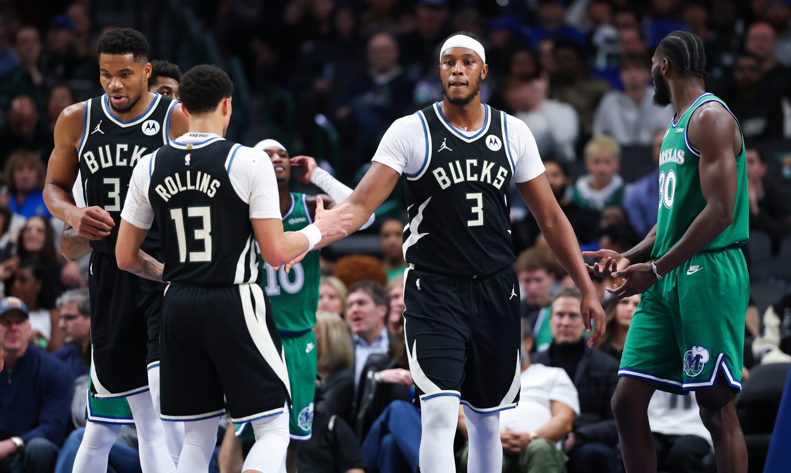 Nov 10, 2025; Dallas, Texas, USA; Milwaukee Bucks center Myles Turner (3) celebrates with Milwaukee Bucks guard Ryan Rollins (13) during the third quarter against the Dallas Mavericks at American Airlines Center. Mandatory Credit: Kevin Jairaj-Imagn Images