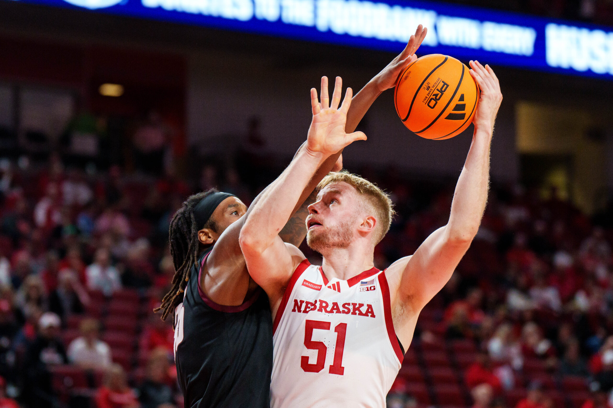 Nov 11, 2025; Lincoln, Nebraska, USA; Nebraska Cornhuskers forward Rienk Mast (51) shoots the ball against Maryland Eastern Shore Hawks forward Christopher Flippin (35) during the first half at Pinnacle Bank Arena. Mandatory Credit: Dylan Widger-Imagn Images