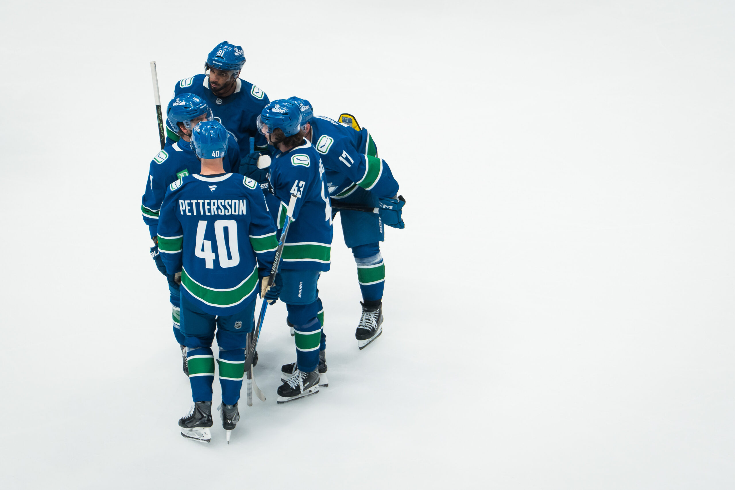 Nov 11, 2025; Vancouver, British Columbia, CAN; Vancouver Canucks forward Evander Kane (91) and forward Conor Garland (8) and forward Elias Pettersson (40) and defenseman Quinn Hughes (43) and defenseman Filip Hronek (17) talk during a stop in play against the Winnipeg Jets in the third period at Rogers Arena. Mandatory Credit: Bob Frid-Imagn Images
