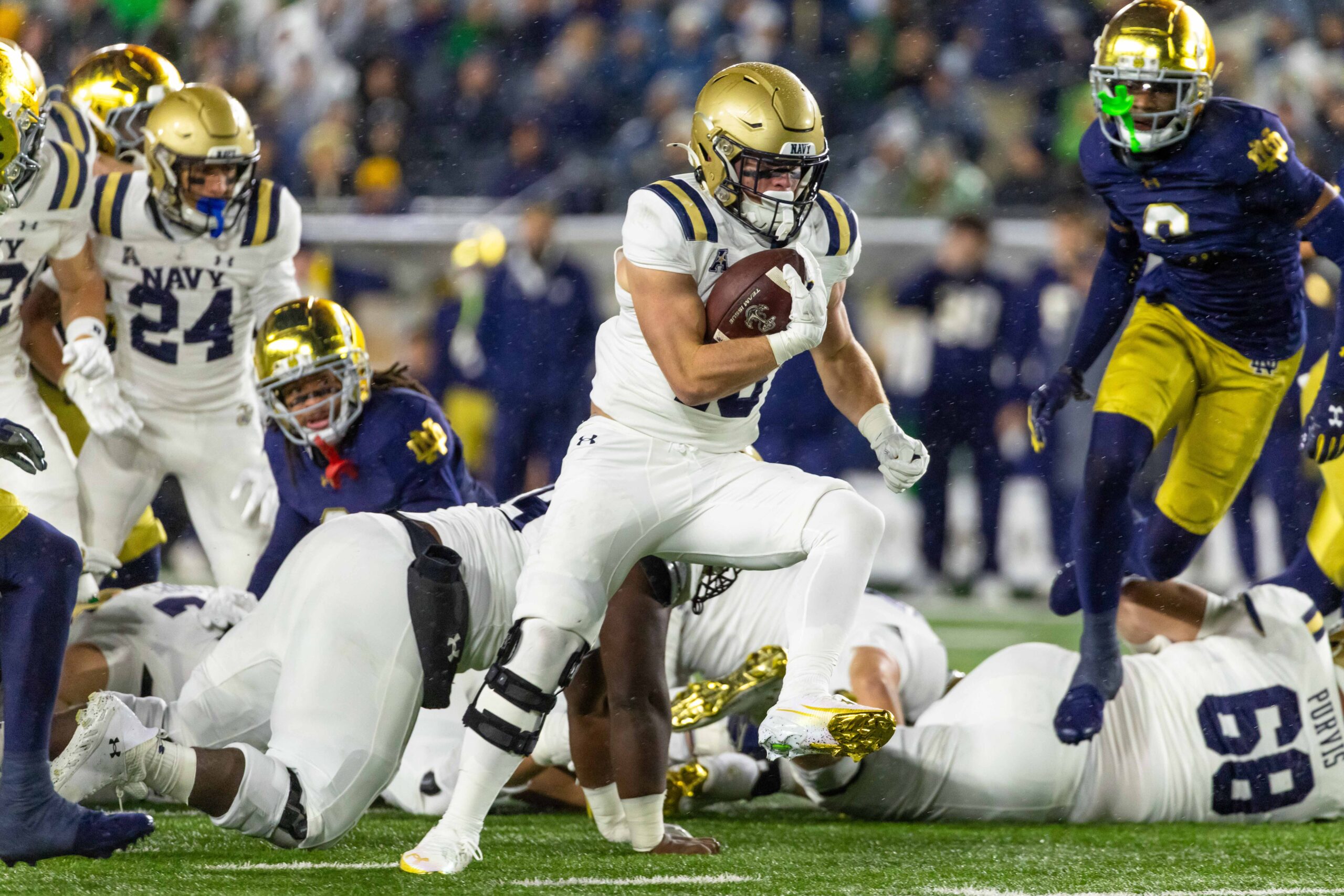 Nov 8, 2025; South Bend, Indiana, USA; Navy Midshipmen fullback Alex Tecza (46) runs the ball against the Notre Dame Fighting Irish during the first half at Notre Dame Stadium. Mandatory Credit: Michael Caterina-Imagn Images