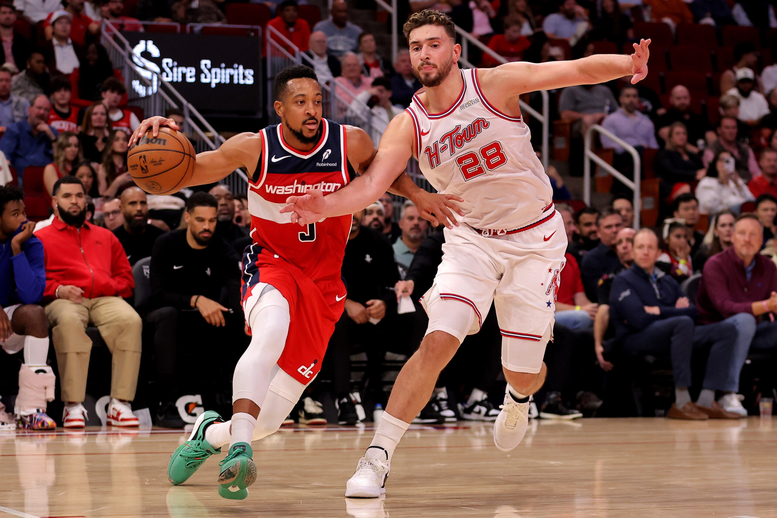 Nov 12, 2025; Houston, Texas, USA; Washington Wizards guard CJ McCollum (3) drives to the basket against Houston Rockets center Alperen Sengun (28) during the game at Toyota Center. Mandatory Credit: Erik Williams-Imagn Images