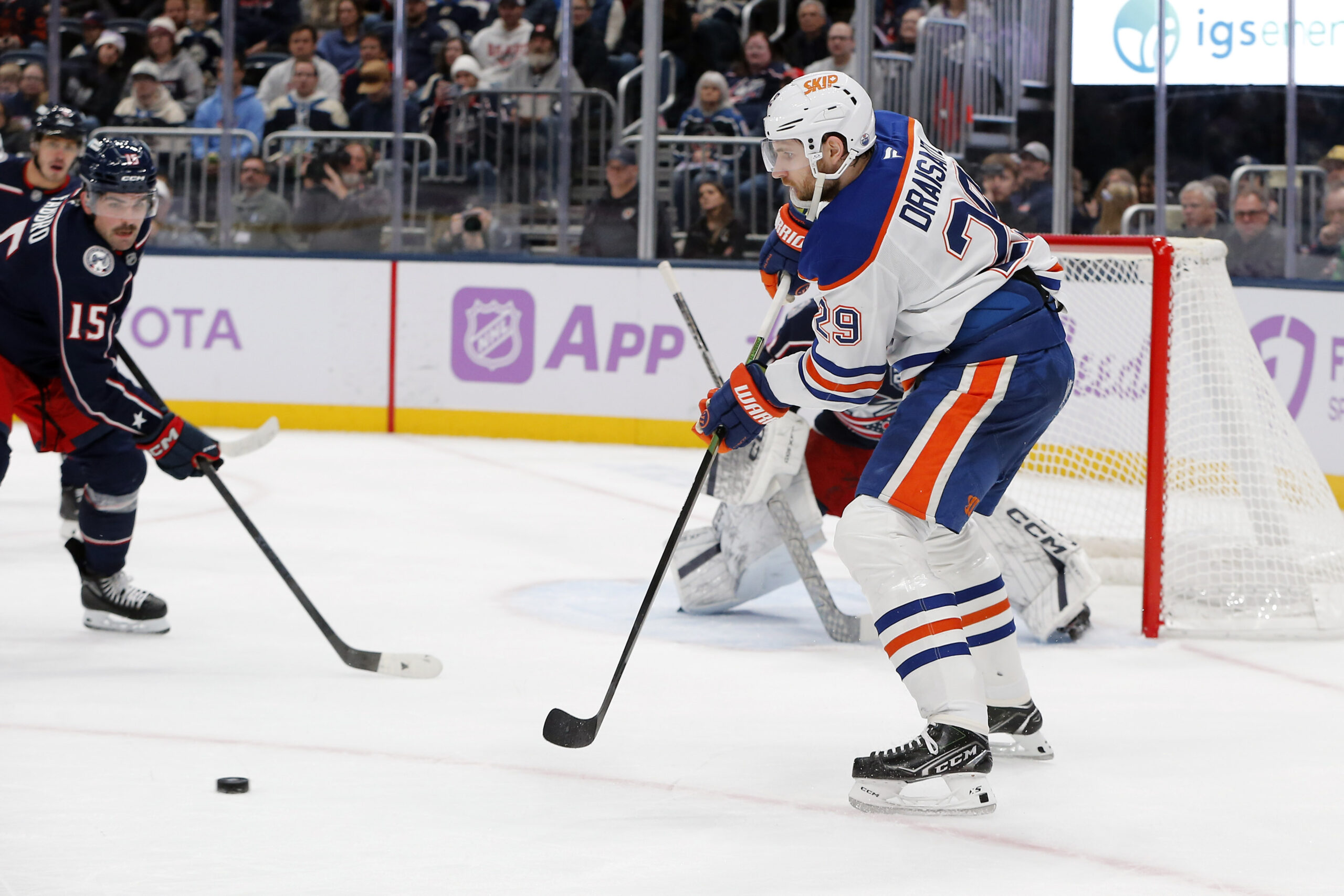 Nov 13, 2025; Columbus, Ohio, USA; Edmonton Oilers center Leon Draisaitl (29) receives a pass in front of Columbus Blue Jackets defenseman Dante Fabbro (15) during the first period at Nationwide Arena. Mandatory Credit: Russell LaBounty-Imagn Images