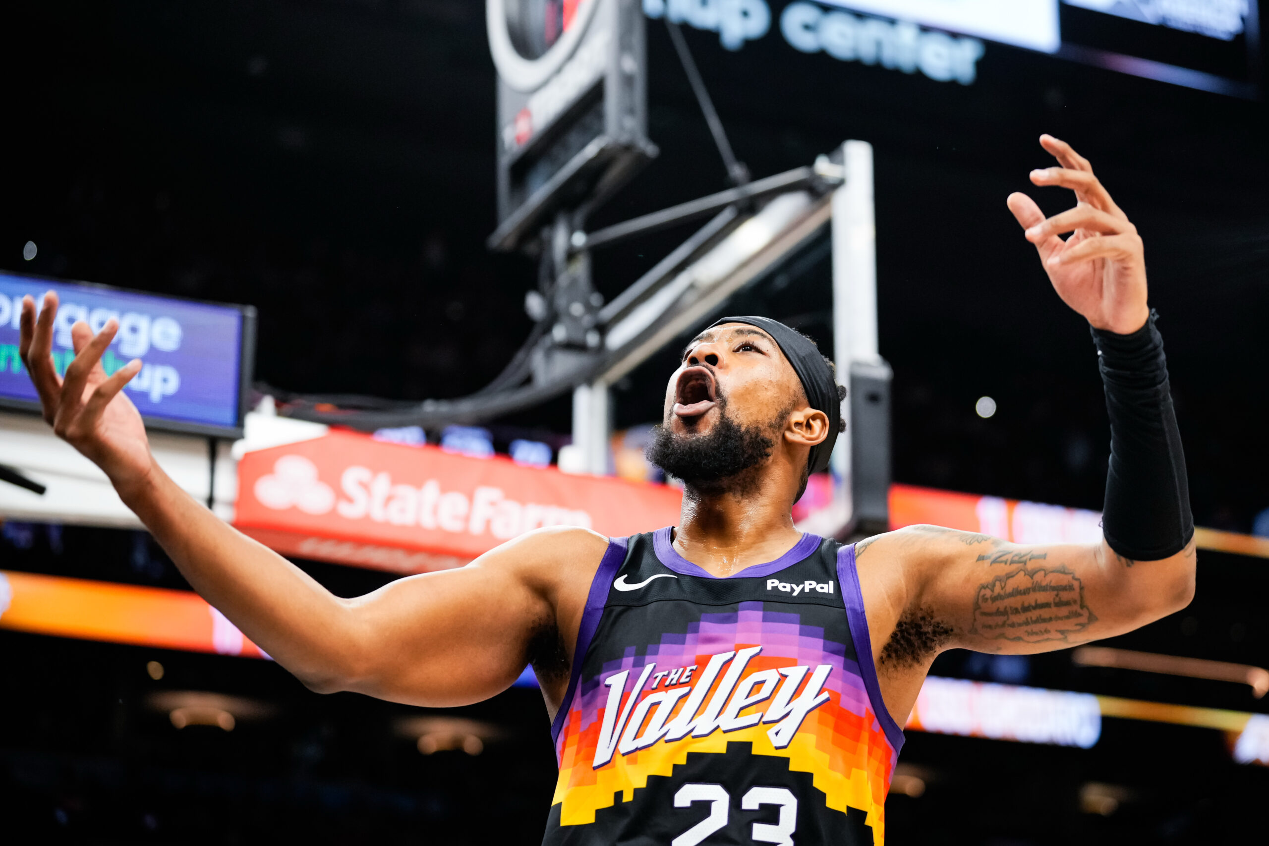 Nov 13, 2025; Phoenix, Arizona, USA; Phoenix Suns guard Jordan Goodwin (23) hypes up the crowd during the second half of the game at Mortgage Matchup Center. Mandatory Credit: Arianna Grainey-Imagn Images