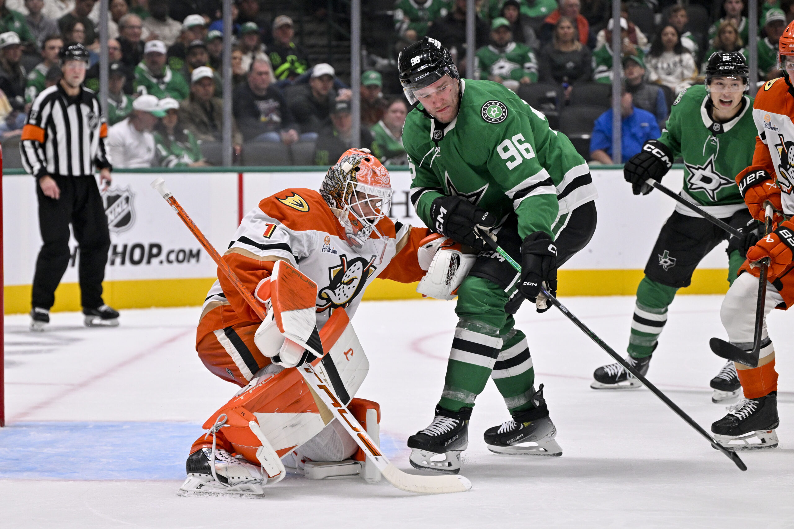 Nov 6, 2025; Dallas, Texas, USA; Anaheim Ducks goaltender Lukas Dostal (1) and Dallas Stars right wing Mikko Rantanen (96) during the game between the Stars and the Ducks at the American Airlines Center. Mandatory Credit: Jerome Miron-Imagn Images