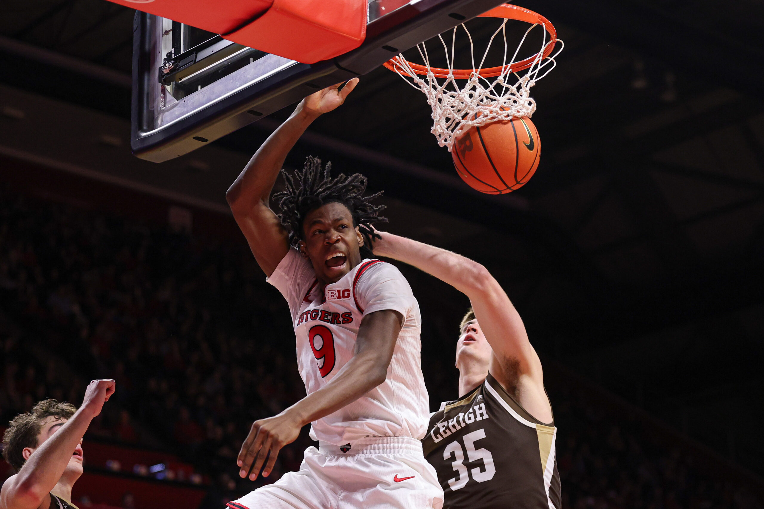 Nov 14, 2025; Piscataway, New Jersey, USA; Rutgers Scarlet Knights forward Dylan Grant (9) dunks the ball during the second half against the Lehigh Mountain Hawks at Jersey Mike's Arena. Mandatory Credit: Vincent Carchietta-Imagn Images