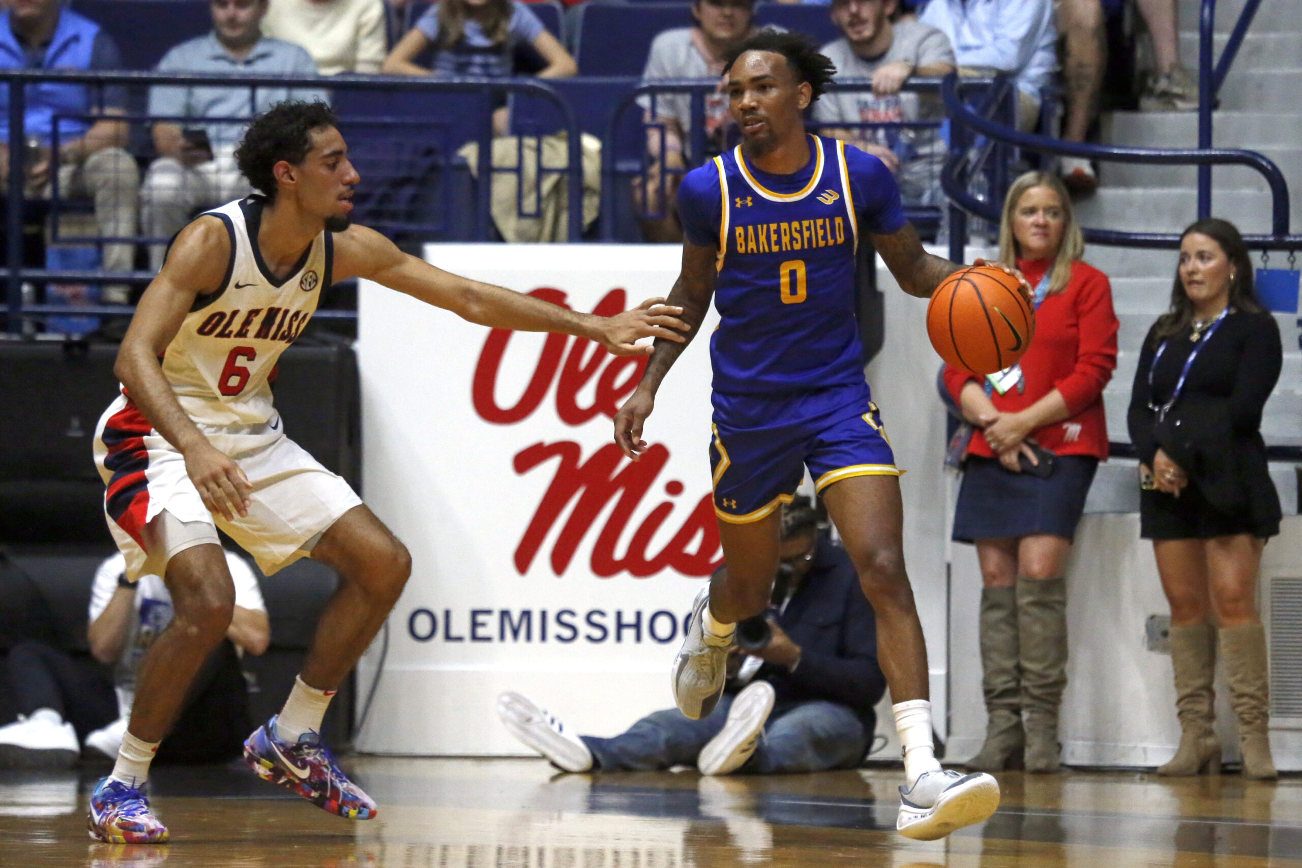 Nov 14, 2025; Oxford, Mississippi, USA; Cal State Bakersfield Roadrunners guard CJ Hardy (0) dribbles as Mississippi Rebels guard Ilias Kamardine (6) defends during the first half at C.M. ’Tad’ Smith Coliseum. Mandatory Credit: Petre Thomas-Imagn Images