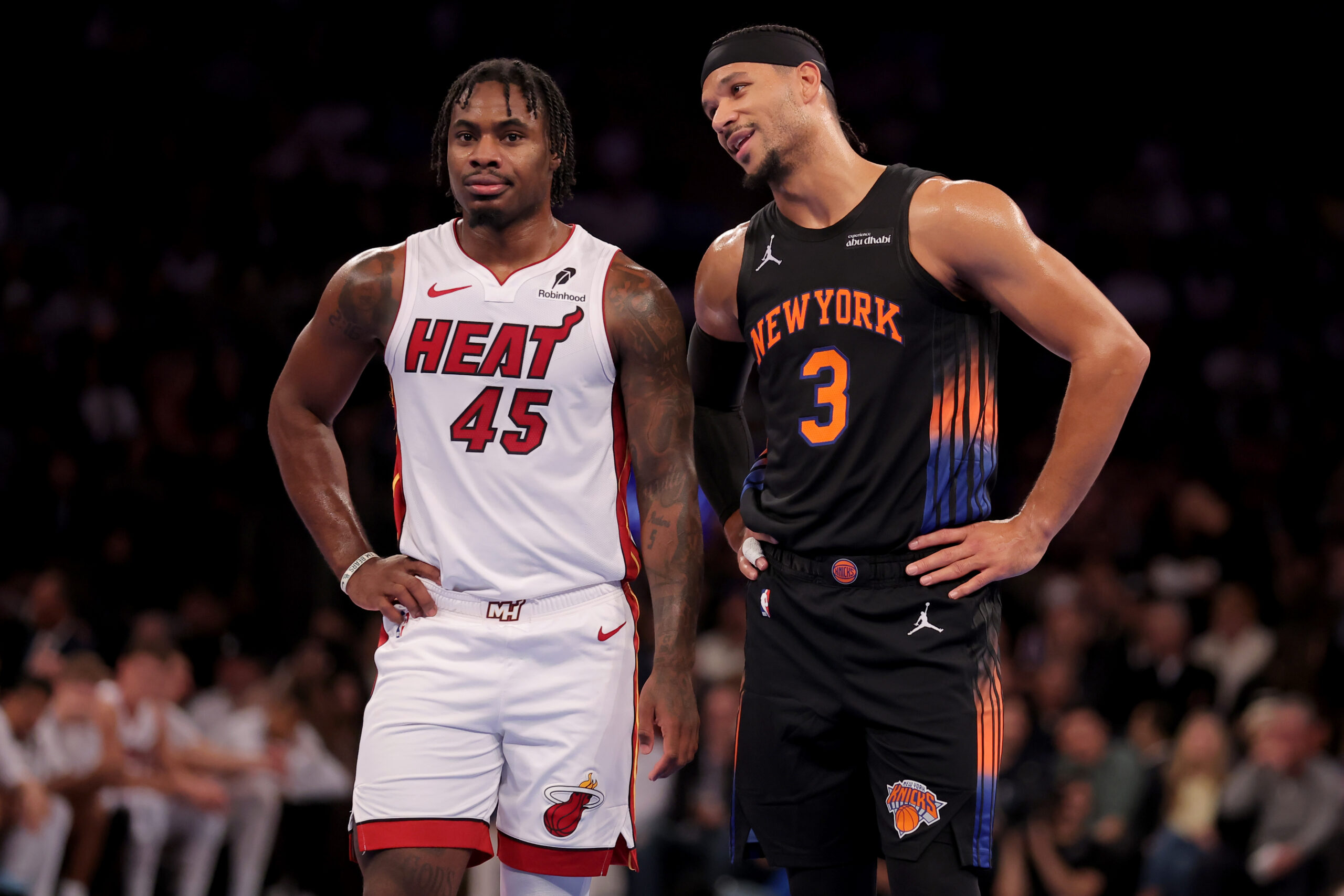 Nov 14, 2025; New York, New York, USA; New York Knicks guard Josh Hart (3) talks to Miami Heat guard Davion Mitchell (45) during the second quarter at Madison Square Garden. Mandatory Credit: Brad Penner-Imagn Images
