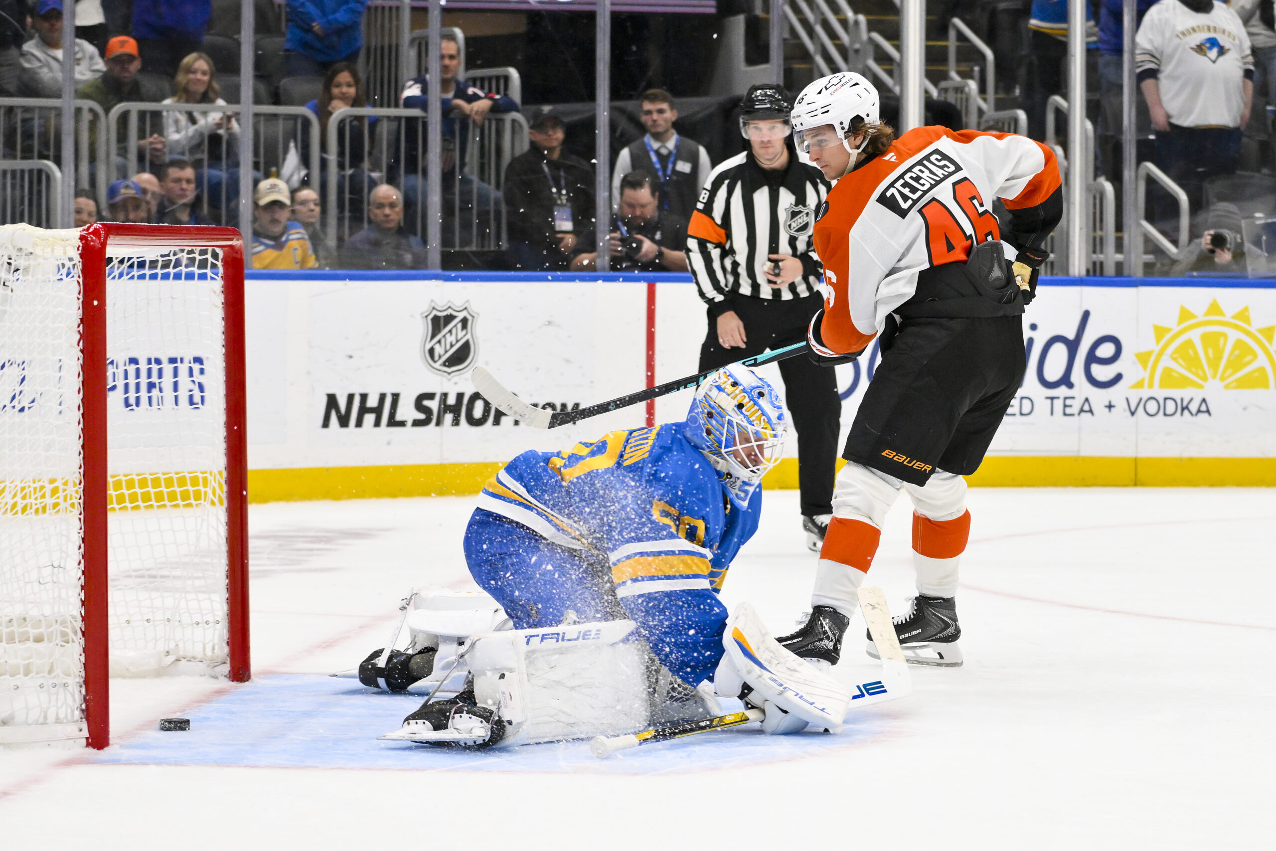 Nov 14, 2025; St. Louis, Missouri, USA; Philadelphia Flyers center Trevor Zegras (46) scores against St. Louis Blues goaltender Jordan Binnington (50) in shootouts at Enterprise Center. Mandatory Credit: Jeff Curry-Imagn Images