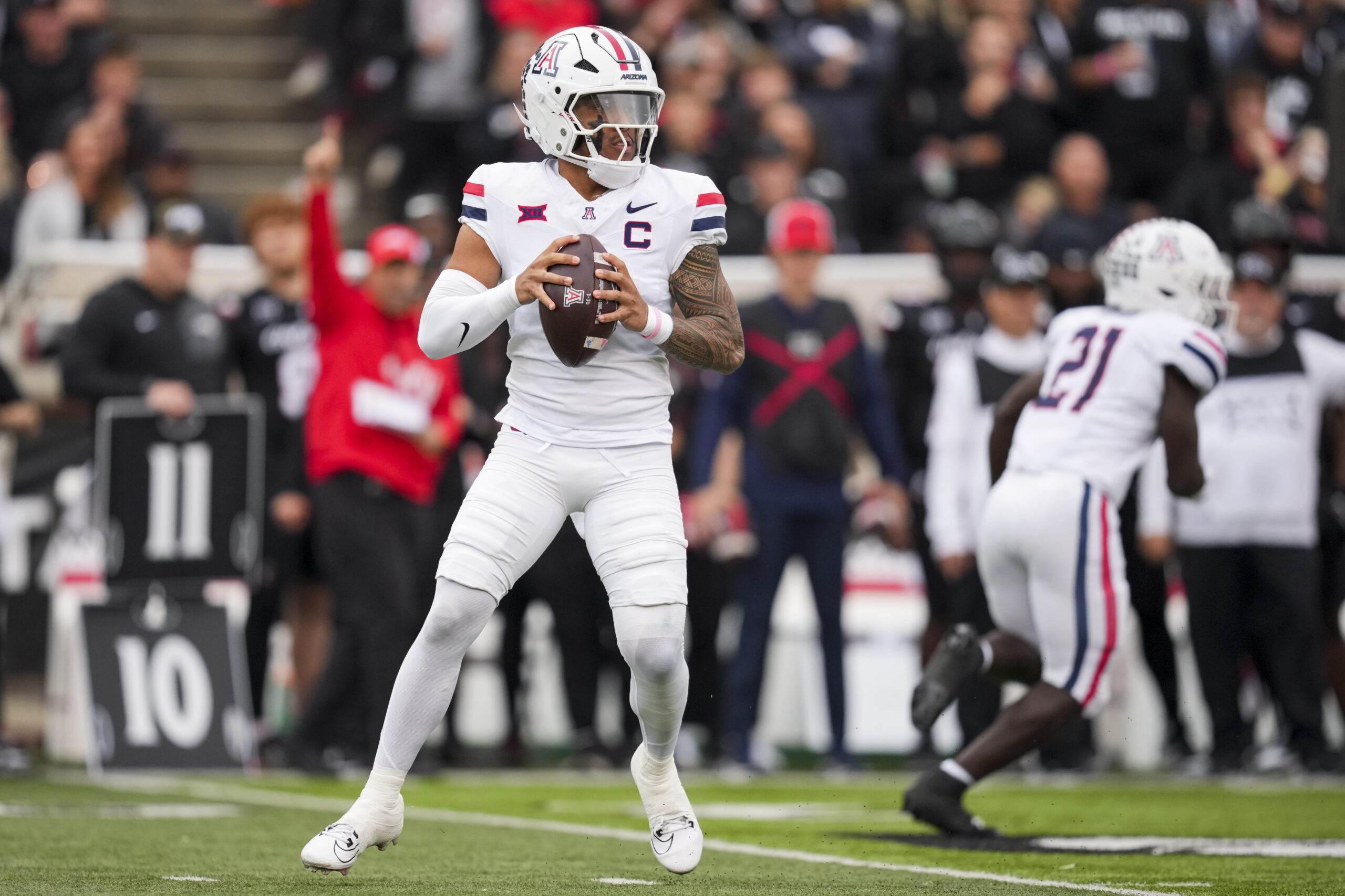 Nov 15, 2025; Cincinnati, Ohio, USA; Arizona Wildcats quarterback Noah Fifita (1) drops back to pass against the Cincinnati Bearcats in the first half at Nippert Stadium. Mandatory Credit: Aaron Doster-Imagn Images