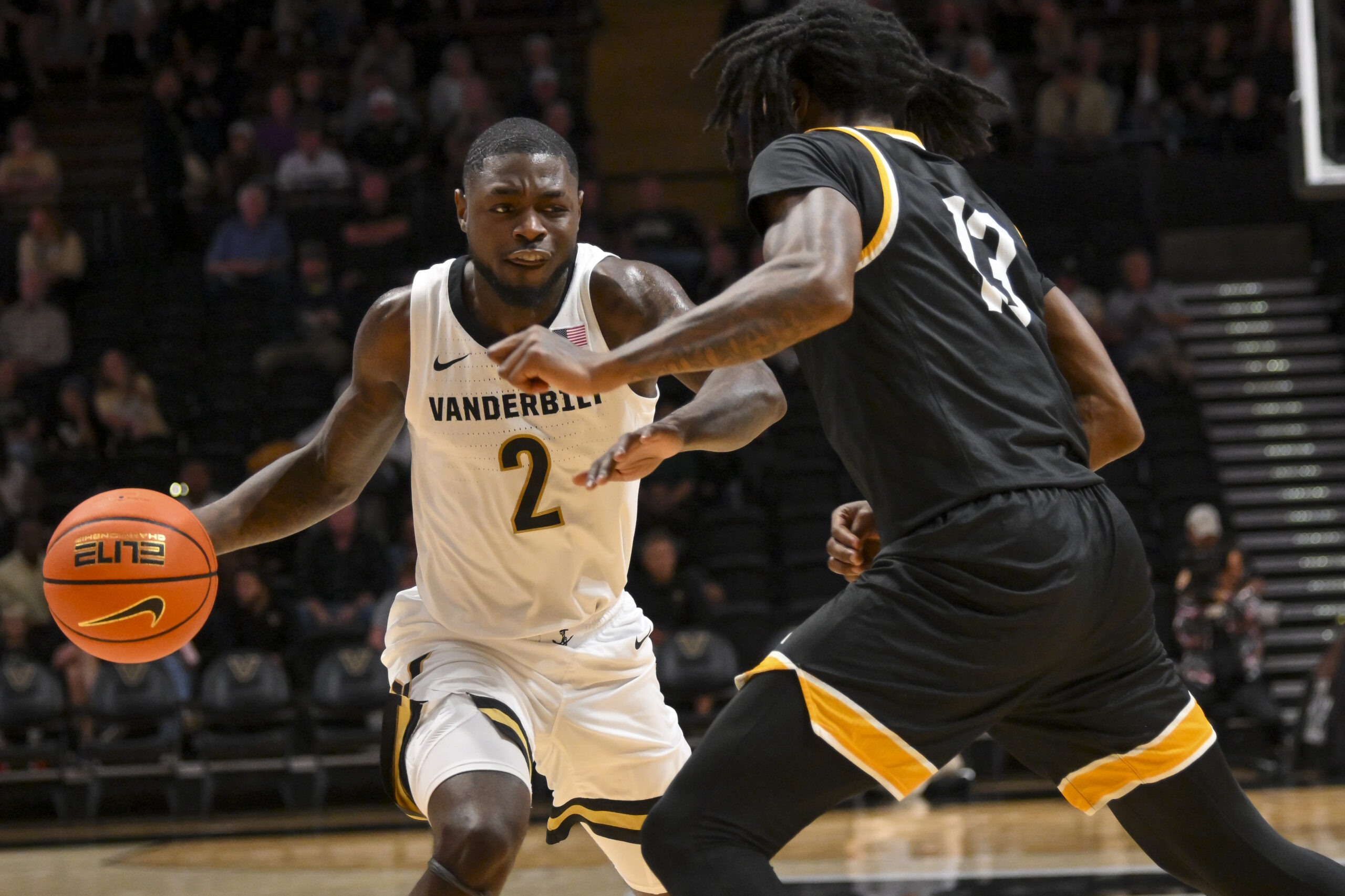 Nov 15, 2025; Nashville, Tennessee, USA; Vanderbilt Commodores guard Duke Miles (2) drives to the basket past Arkansas-Pine Bluff Golden Lions guard Quion Williams (13) during the first half at Memorial Gymnasium. Mandatory Credit: Steve Roberts-Imagn Images