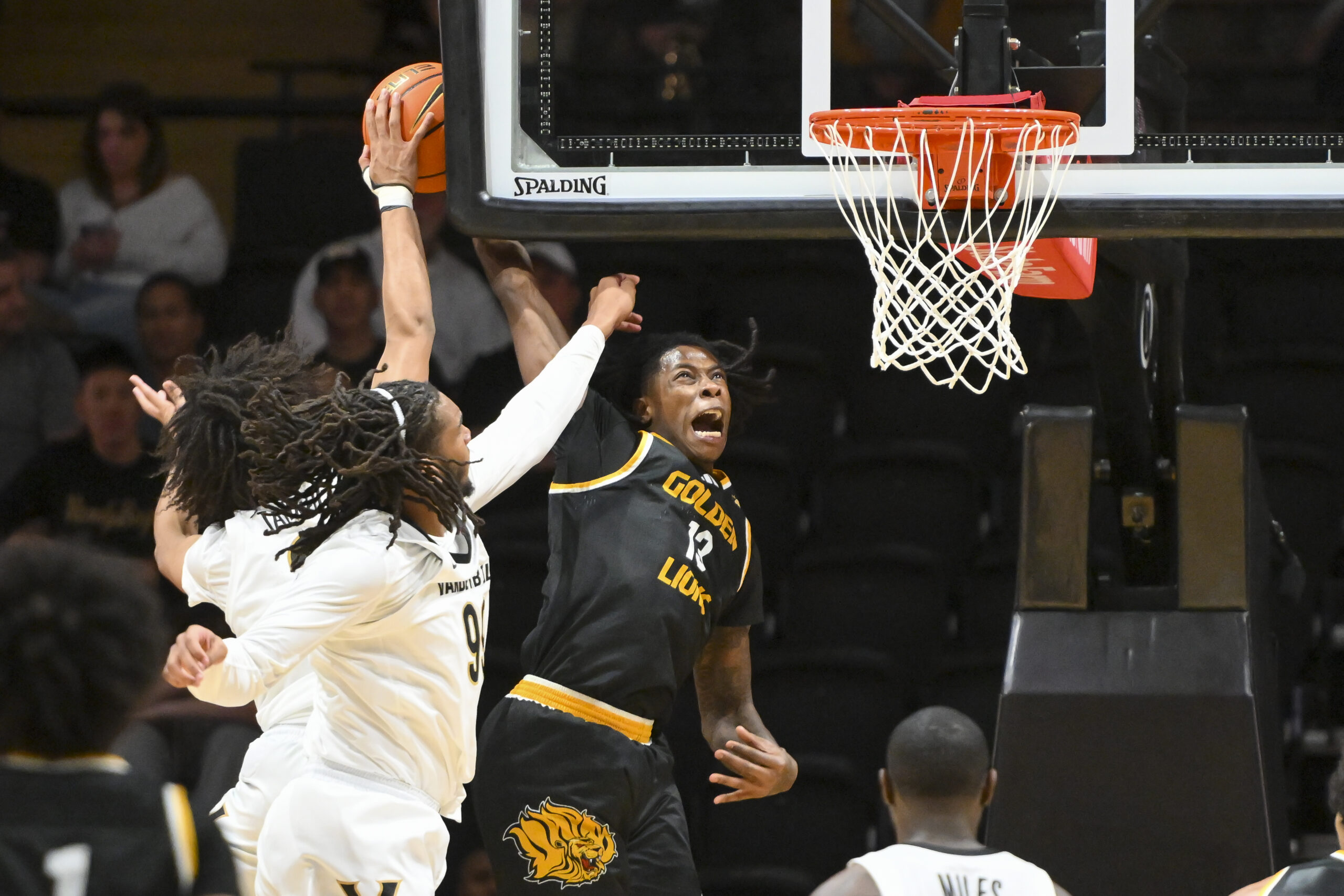 Nov 15, 2025; Nashville, Tennessee, USA;  Vanderbilt Commodores guard Tyler Tanner (3) and forward Devin McGlockton (99) blocks the shot of  Arkansas-Pine Bluff Golden Lions guard Quion Williams (13) during the second half at Memorial Gymnasium. Mandatory Credit: Steve Roberts-Imagn Images