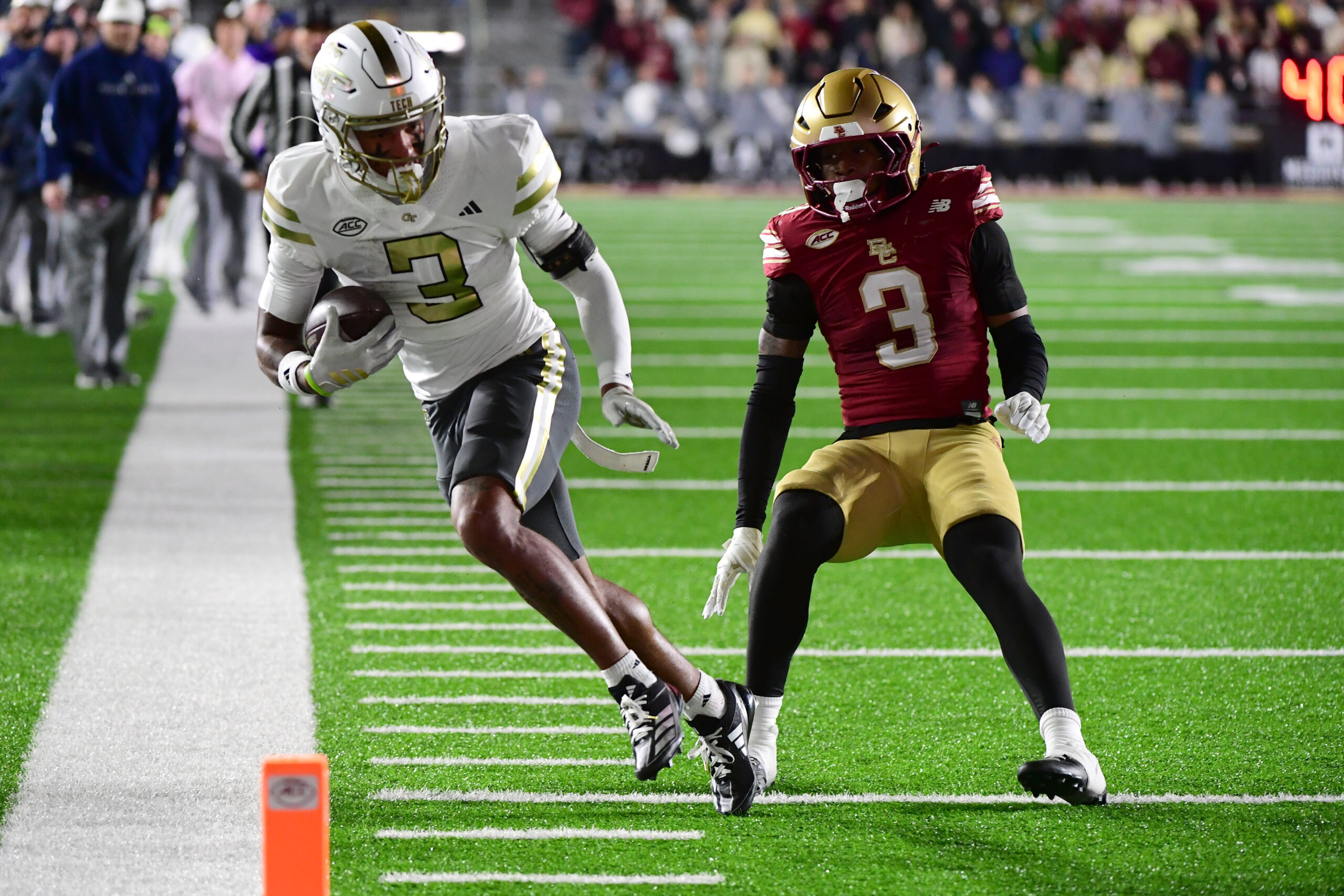 Nov 15, 2025; Chestnut Hill, Massachusetts, USA; Georgia Tech Yellow Jackets wide receiver Eric Rivers (3) runs with the ball while Boston College Eagles defensive back Max Tucker (3) defends during the second half at Alumni Stadium. Mandatory Credit: Bob DeChiara-Imagn Images
