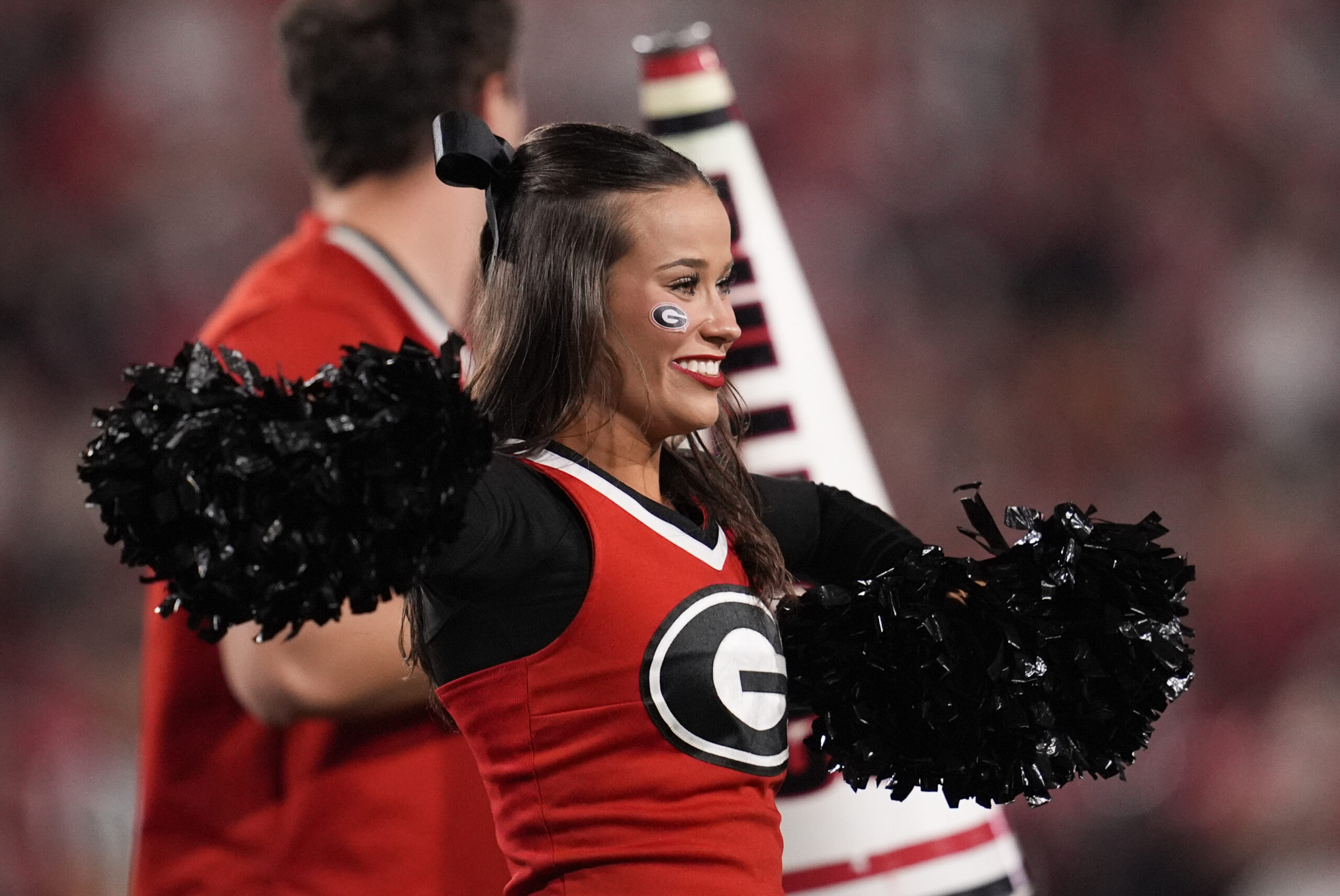 Nov 15, 2025; Athens, Georgia, USA; A Georgia Bulldogs cheerleader performs in the first half against the Texas Longhorns at Sanford Stadium. Mandatory Credit: Dale Zanine-Imagn Images