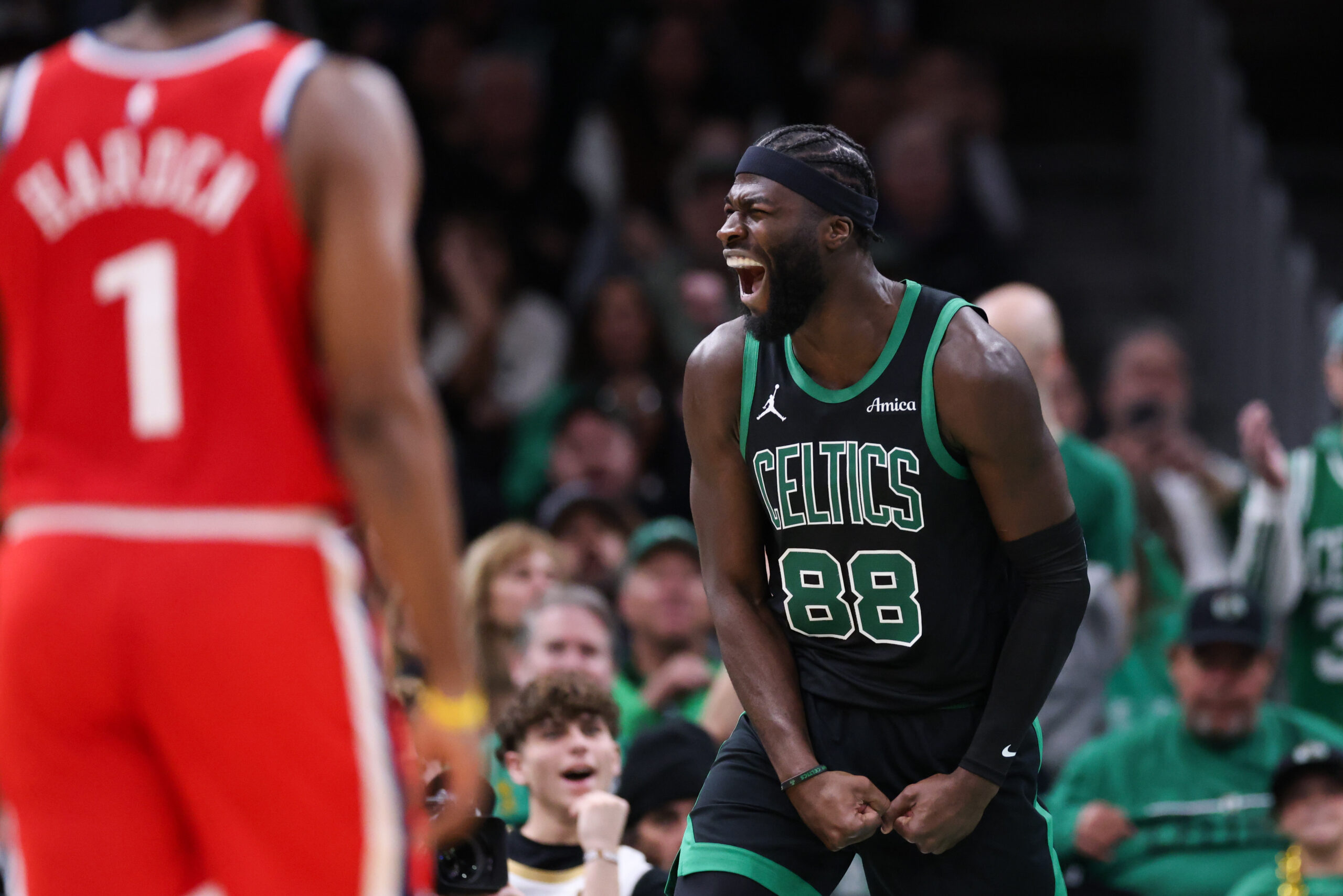 Nov 16, 2025; Boston, Massachusetts, USA; Boston Celtics center Neemias Queta (88) celebrates after a basket during the second half against the Los Angeles Clippers at TD Garden. Mandatory Credit: Paul Rutherford-Imagn Images