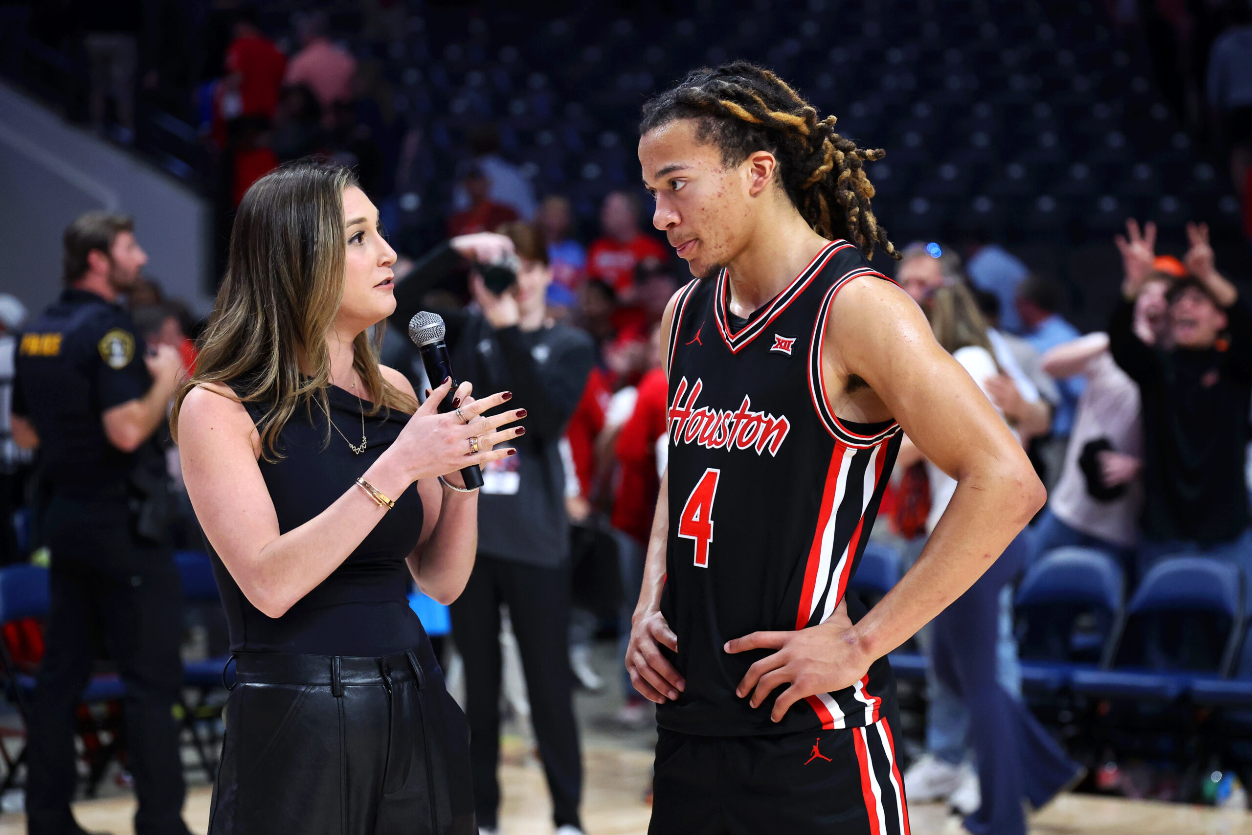 Nov 16, 2025; Birmingham, Alabama, USA; Houston Cougars guard Kingston Flemings (4) is interviewed after their victory against the Auburn Tigers at Legacy Arena at BJCC. Mandatory Credit: David Leong-Imagn Images