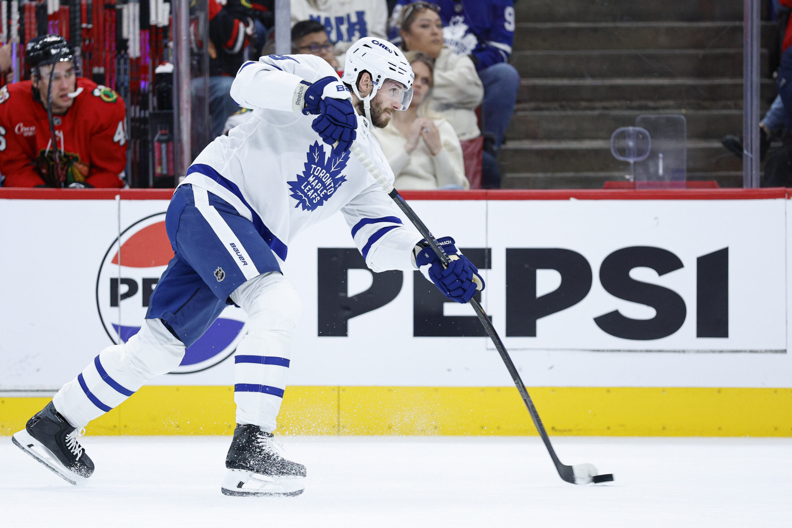 Nov 15, 2025; Chicago, Illinois, USA; Toronto Maple Leafs defenseman Oliver Ekman-Larsson (95) shoots against the Chicago Blackhawks during the first period at United Center. Mandatory Credit: Kamil Krzaczynski-Imagn Images