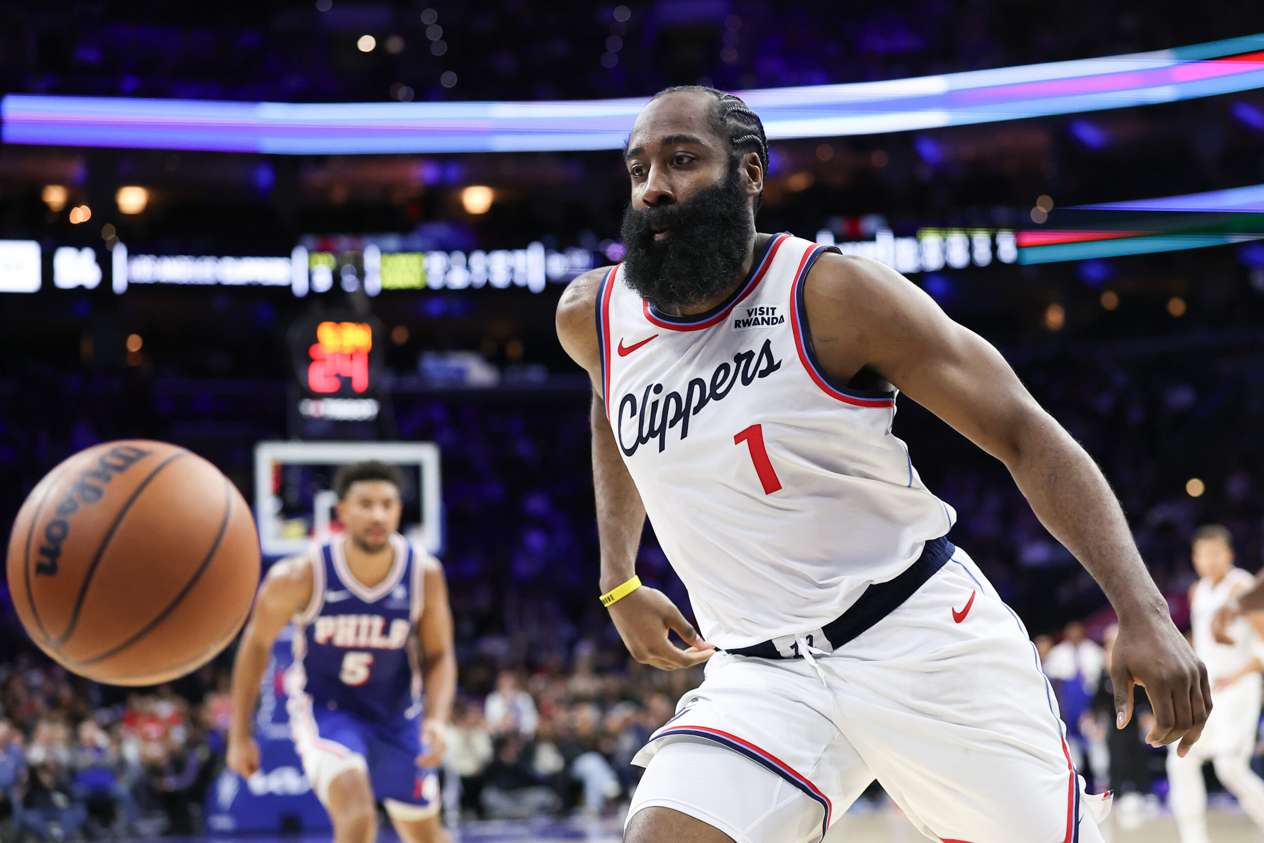 Nov 17, 2025; Philadelphia, Pennsylvania, USA; LA Clippers guard James Harden (1) chases a loose ball against the Philadelphia 76ers during the fourth quarter at Xfinity Mobile Arena. Mandatory Credit: Bill Streicher-Imagn Images