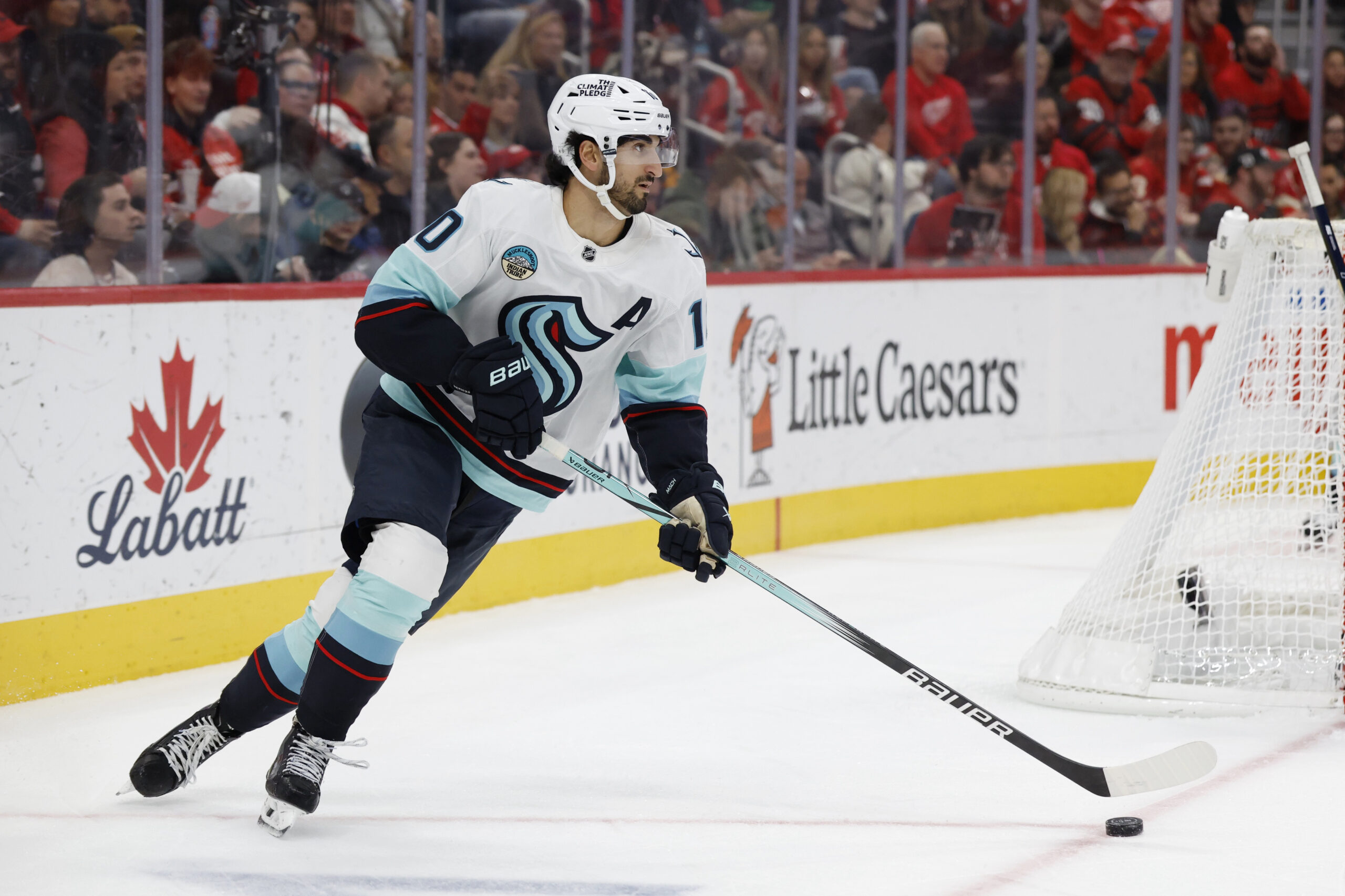 Nov 18, 2025; Detroit, Michigan, USA; Seattle Kraken center Matty Beniers (10) skates with the puck in the second period against the Detroit Red Wings at Little Caesars Arena. Mandatory Credit: Rick Osentoski-Imagn Images