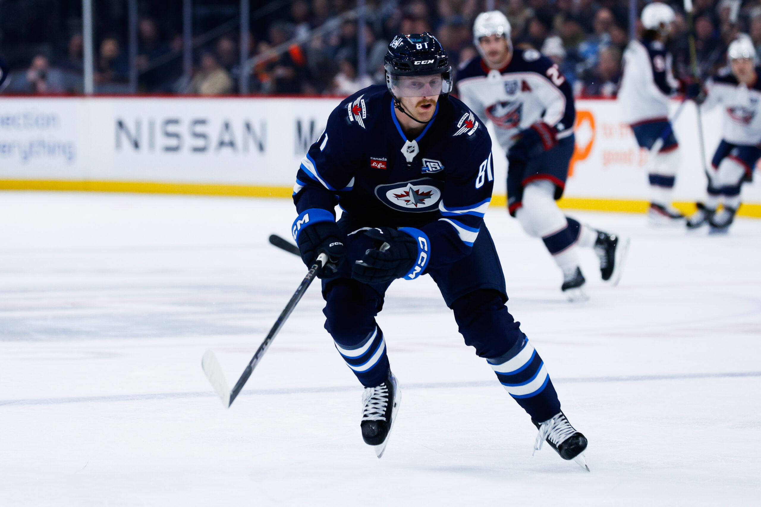 Nov 18, 2025; Winnipeg, Manitoba, CAN; Winnipeg Jets forward Kyle Connor (81) skies after the puck in the Colorado Avalanche zone during the first period at Canada Life Centre. Mandatory Credit: Terrence Lee-Imagn Images