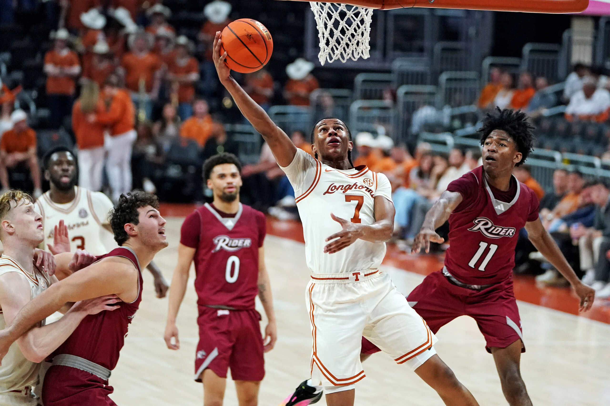 Nov 18, 2025; Austin, Texas, USA; Texas Longhorns guard Simeon Wilcher (7) makes a lay up against Rider Broncs guard Flash Burton (11) during the second half at Moody Center. Mandatory Credit: Dustin Safranek-Imagn Images
