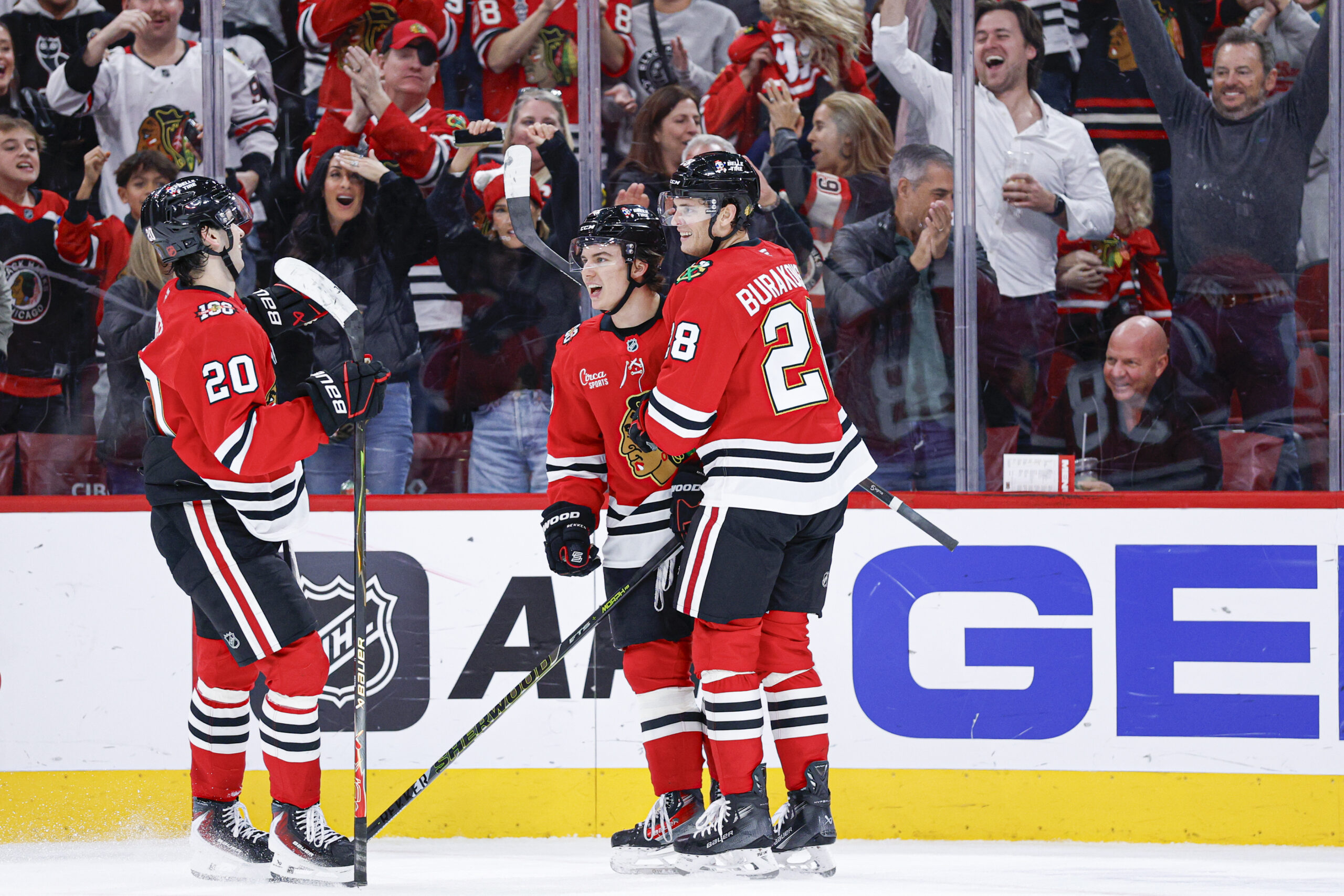 Nov 18, 2025; Chicago, Illinois, USA; Chicago Blackhawks center Connor Bedard (98) celebrates with teammates after scoring against the Calgary Flames during the second period at United Center. Mandatory Credit: Kamil Krzaczynski-Imagn Images