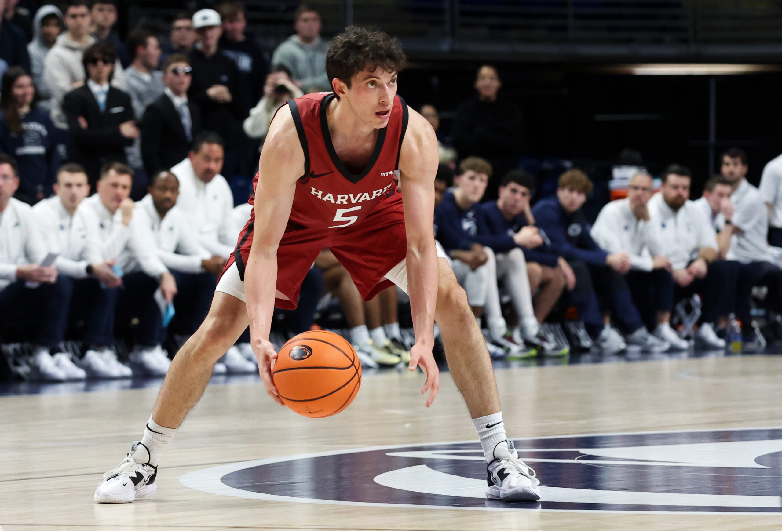 Nov 19, 2025; University Park, Pennsylvania, USA; Harvard Crimson guard Ben Eisendrath (5) dribbles the ball during the second half against the Penn State Nittany Lions at Bryce Jordan Center. Mandatory Credit: Matthew O'Haren-Imagn Images