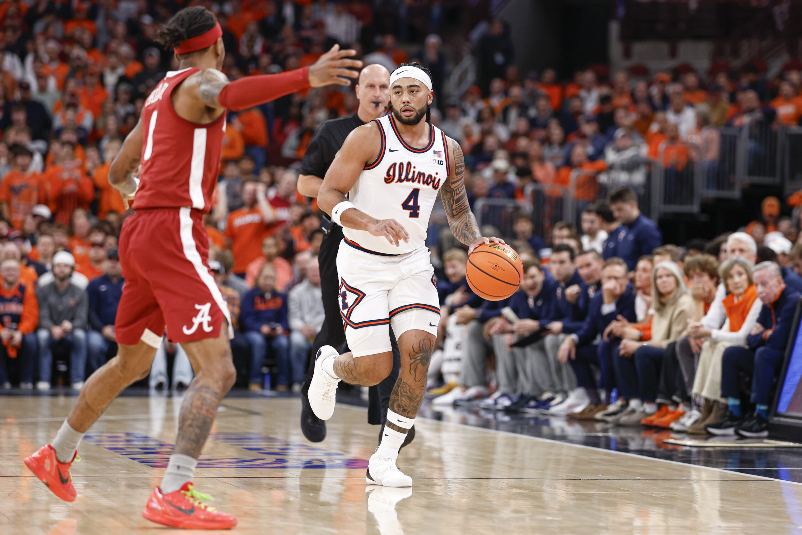 Nov 19, 2025; Chicago, Illinois, USA; Illinois Fighting Illini guard Kylan Boswell (4) brings the ball up court against Alabama Crimson Tide guard Labaron Philon (0) during the first half at United Center. Mandatory Credit: Kamil Krzaczynski-Imagn Images