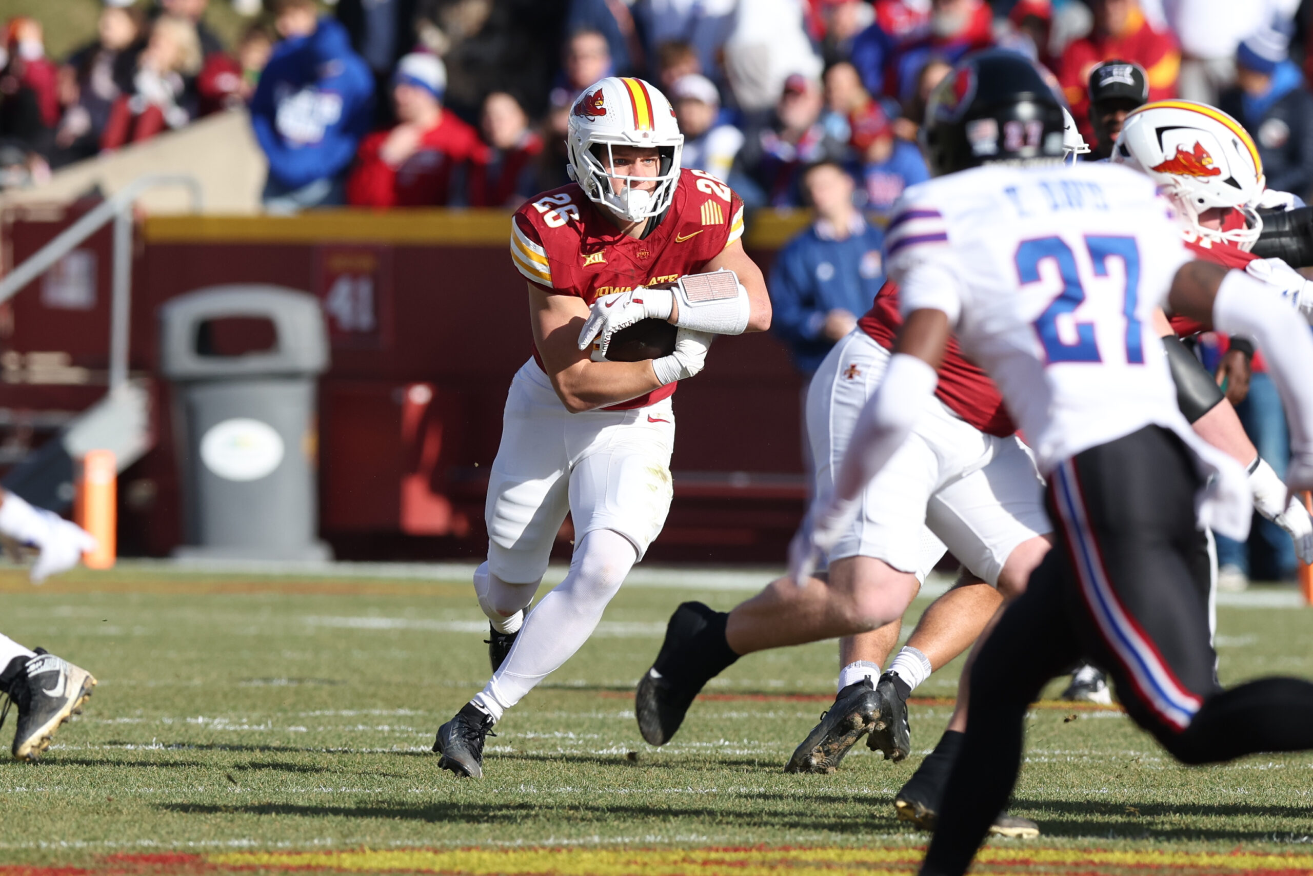 Nov 22, 2025; Ames, Iowa, USA; Iowa State Cyclones running back Carson Hansen (26) runs the football against the Kansas Jayhawks during the first half at Jack Trice Stadium. Mandatory Credit: Reese Strickland-Imagn Images
