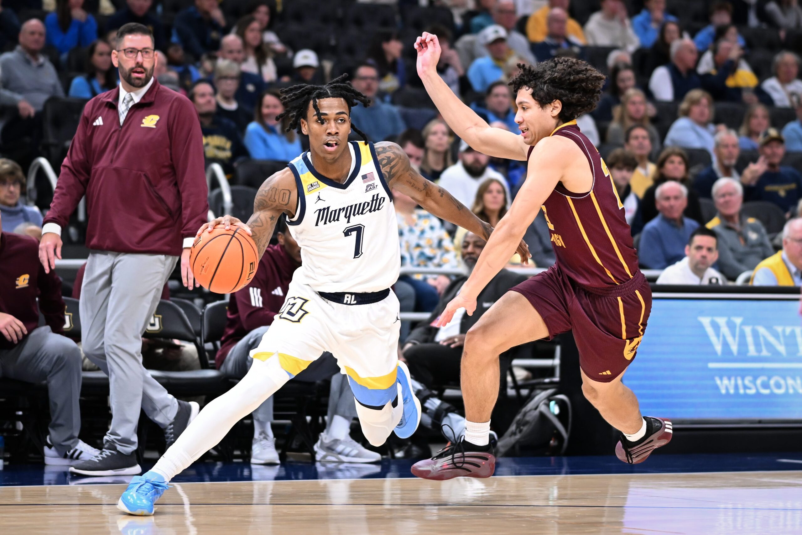Marquette guard Zaide Lowery (7) drives past Central Michigan guard Will Ashford (22) in the first half of a game Saturday, November 22, 2025, at Fiserv Forum in Milwaukee, Wisconsin.